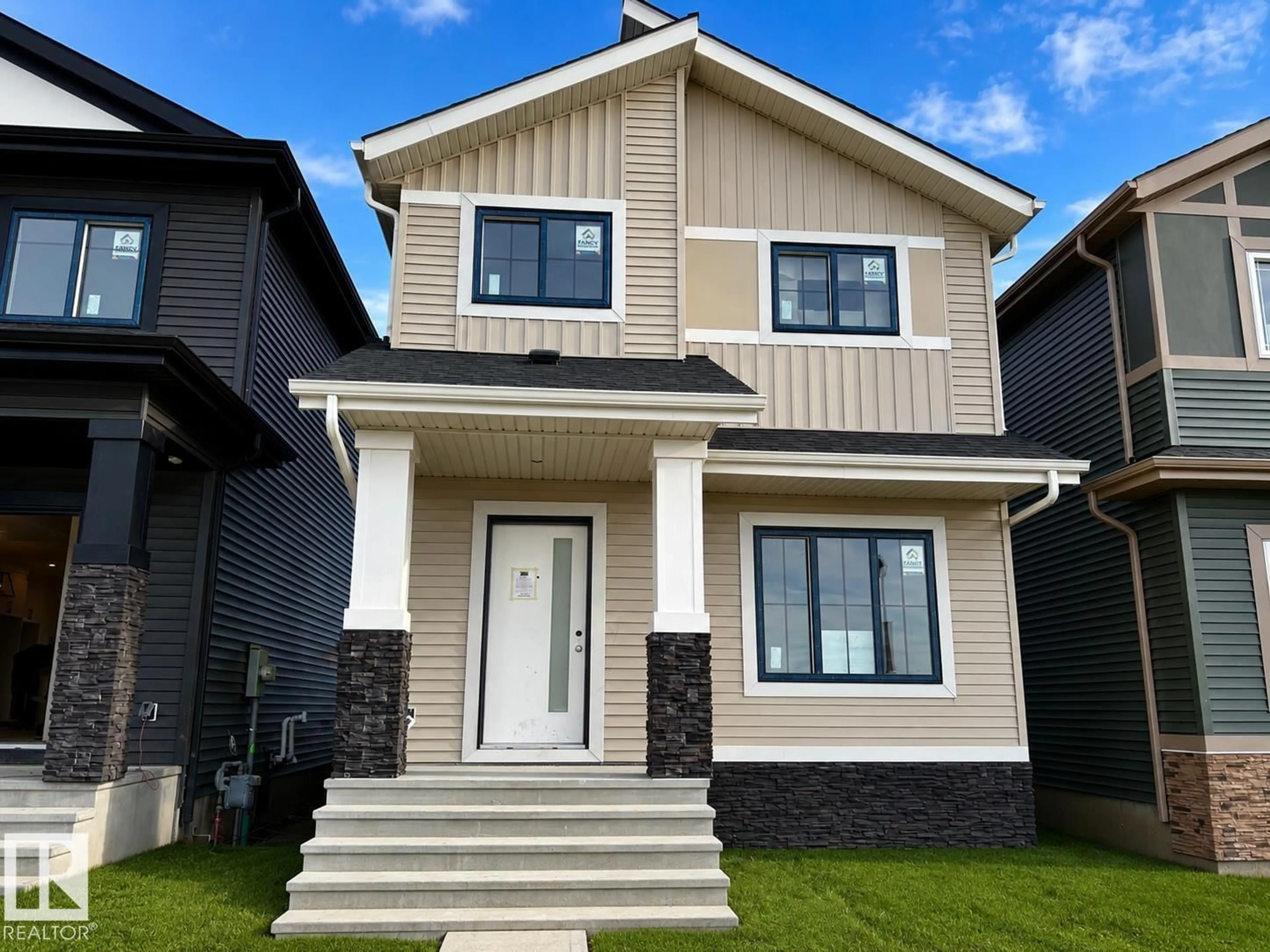 Home with vinyl exterior material, street for 9827 107A AV, Morinville Alberta T8R2P1