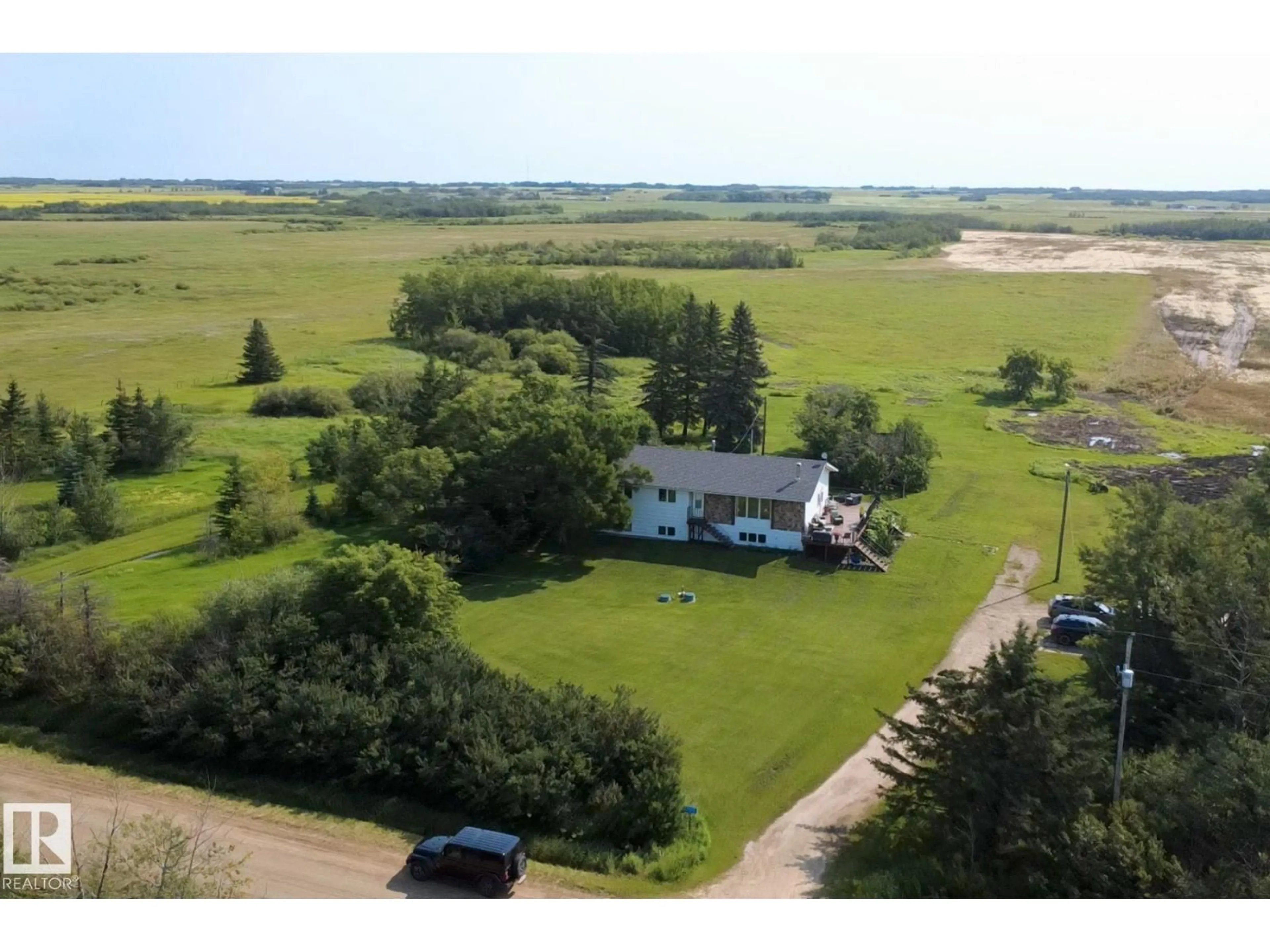 A pic from outside/outdoor area/front of a property/back of a property/a pic from drone, water/lake/river/ocean view for 532077 RR 180, Rural Lamont County Alberta T0B3H0