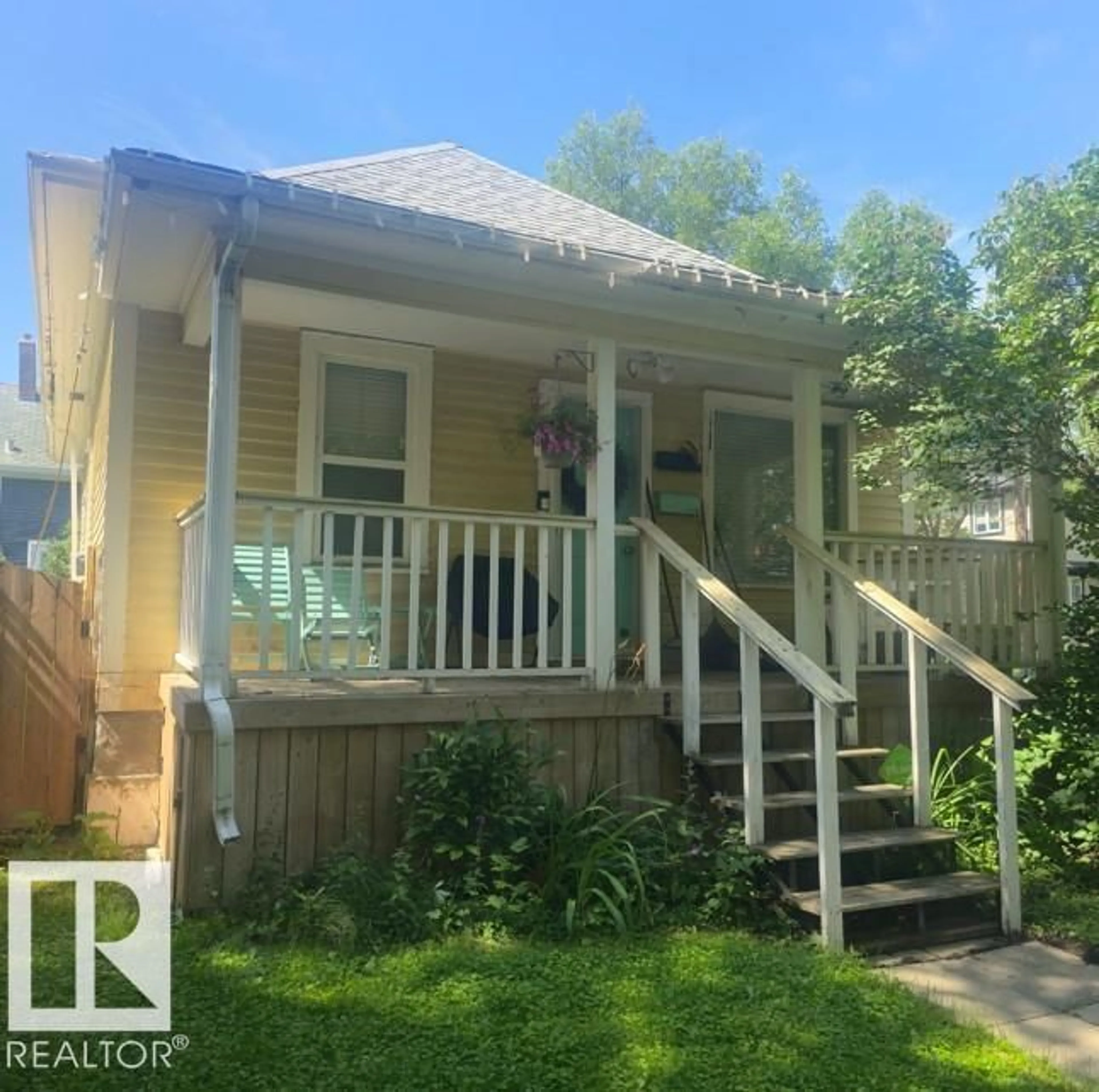 Home with vinyl exterior material, street for 11348 91 ST, Edmonton Alberta T5B4A3