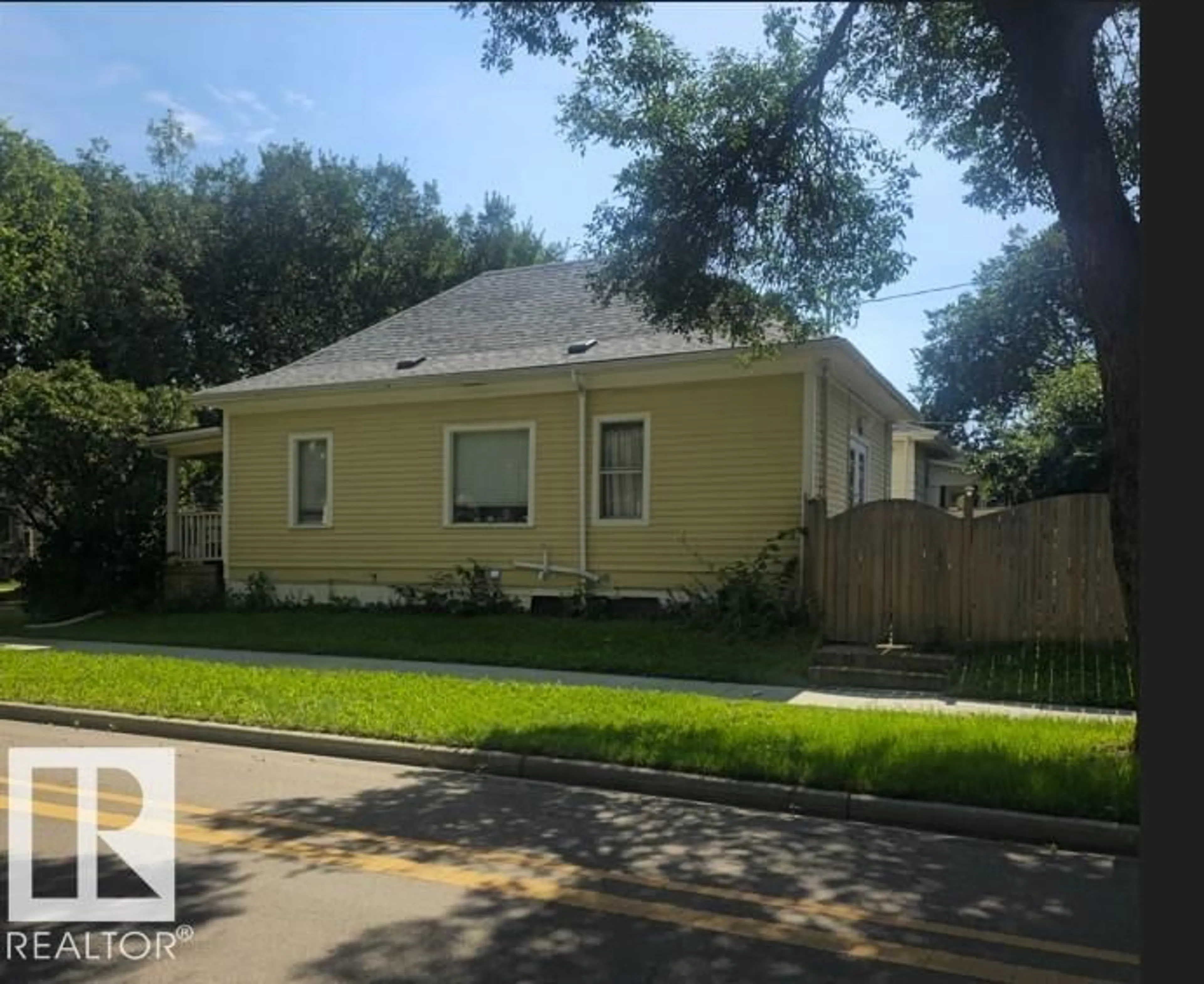 Home with vinyl exterior material, street for 11348 91 ST, Edmonton Alberta T5B4A3