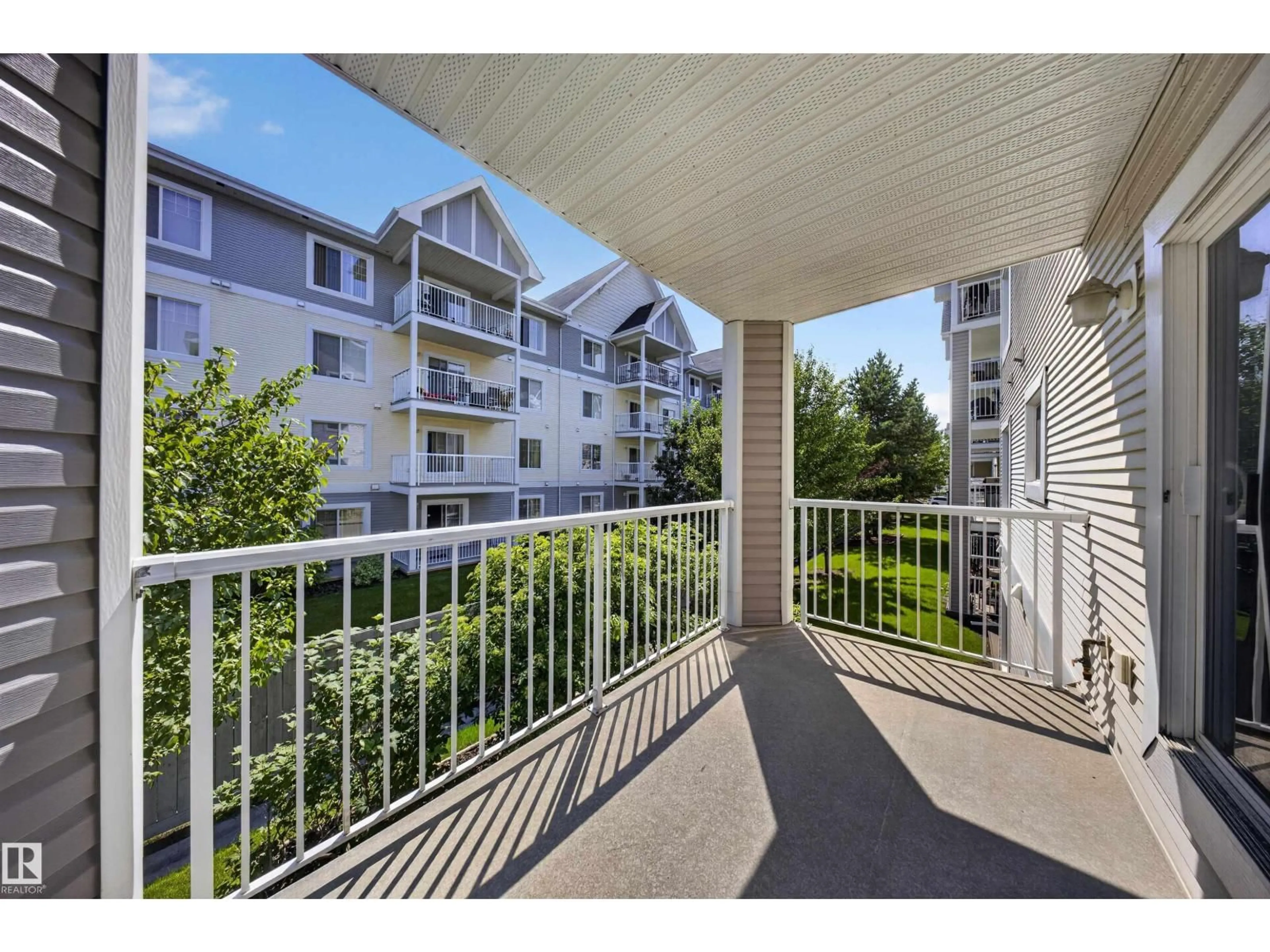 Balcony in the apartment, city buildings view from balcony for #215 - 4403 23 ST, Edmonton Alberta T6T0E4