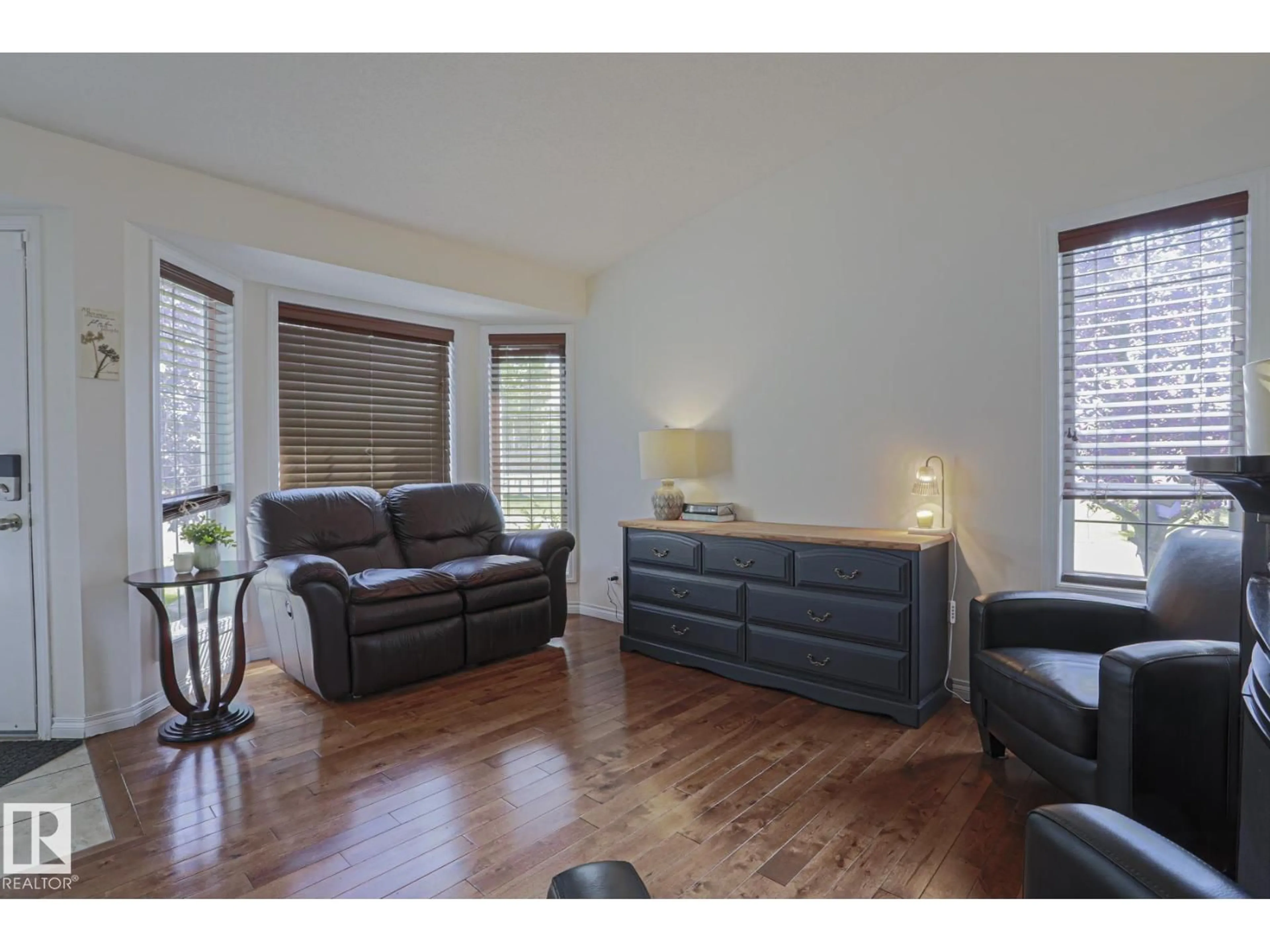 Living room with furniture, wood/laminate floor for 1 LEYLAND WY, Spruce Grove Alberta T7X0A8
