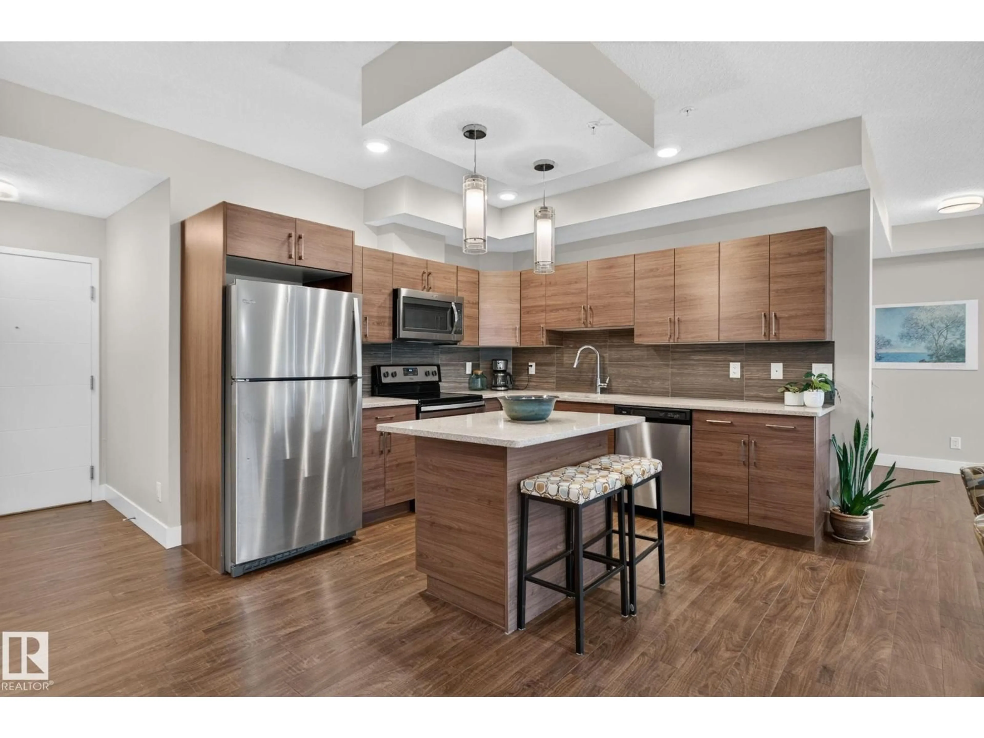 Open concept kitchen, wood/laminate floor for 301 - 10006 83 AV, Edmonton Alberta T6E2C2