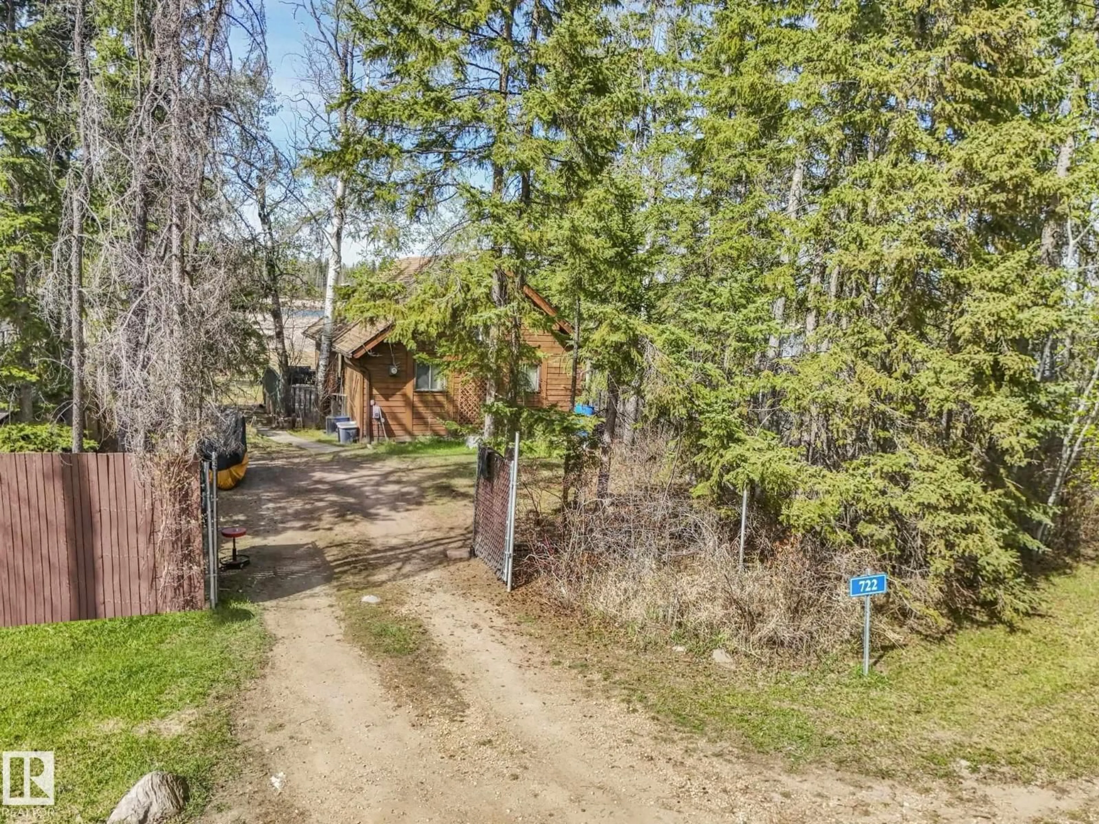 A pic from outside/outdoor area/front of a property/back of a property/a pic from drone, forest/trees view for 722 BLUE HERON DR, Rural Lac Ste. Anne County Alberta T0E1V0