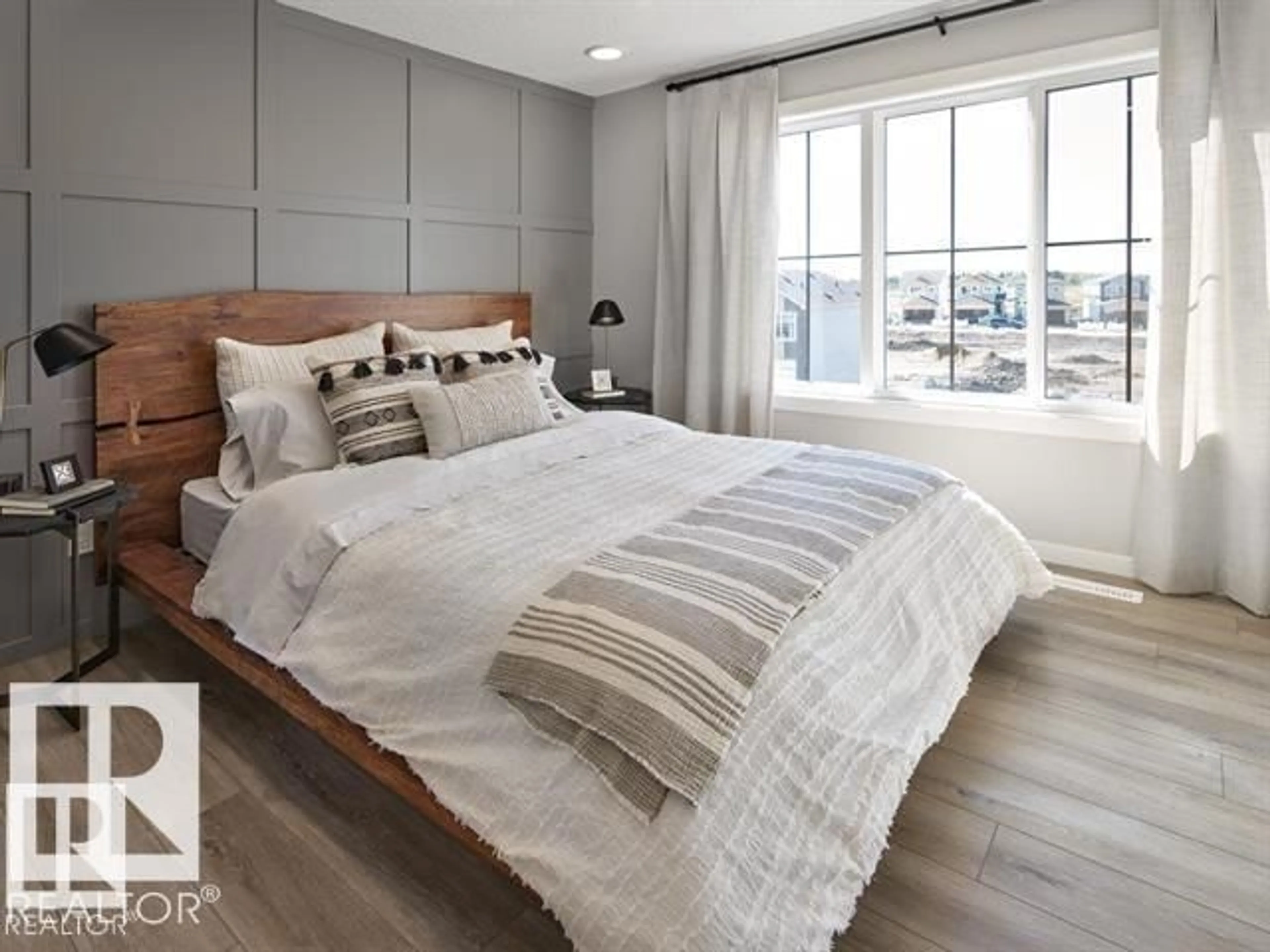 Bedroom with bed, wood/laminate floor for #109 - 1025 SECORD PROMENADE PM, Edmonton Alberta T5T7V4