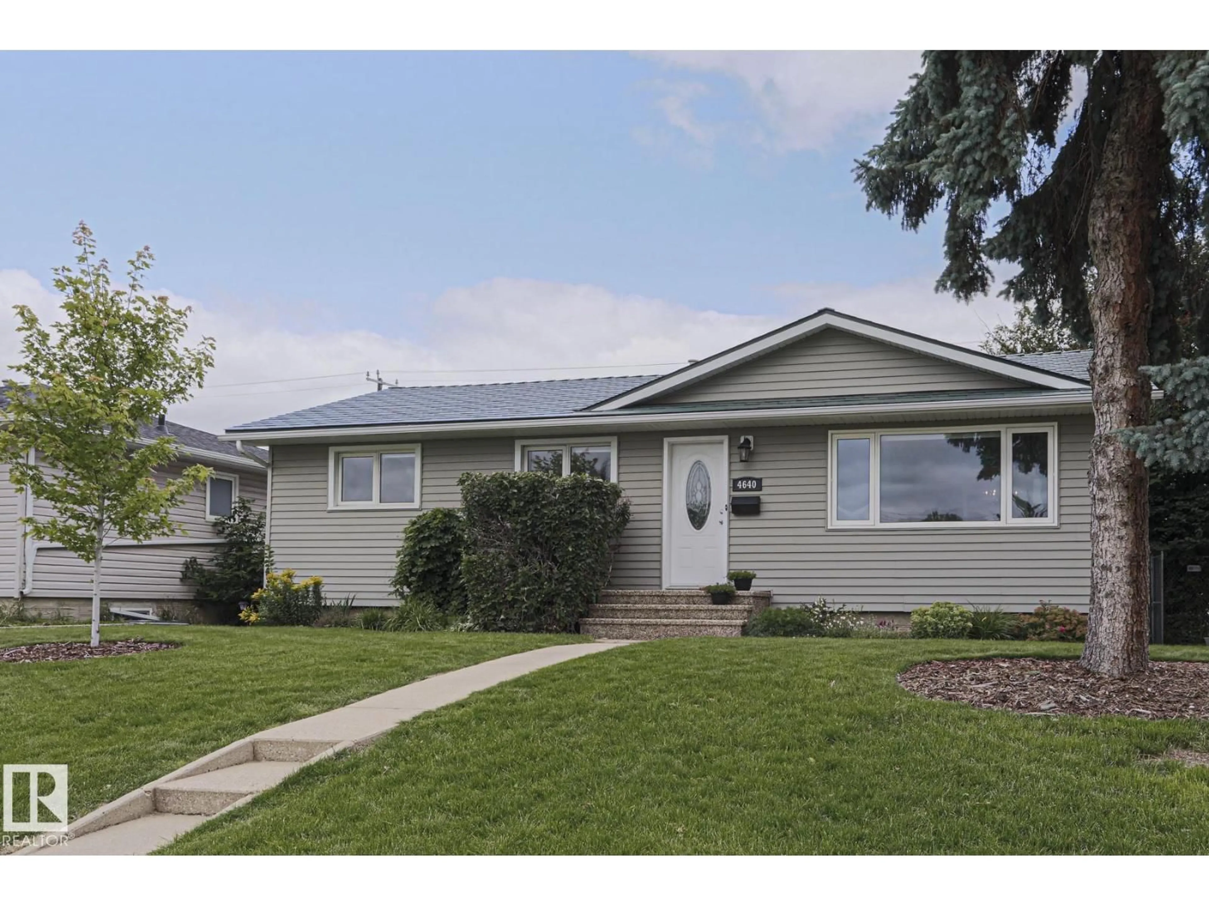Home with vinyl exterior material, street for 4640 102A AV, Edmonton Alberta T6A0R1