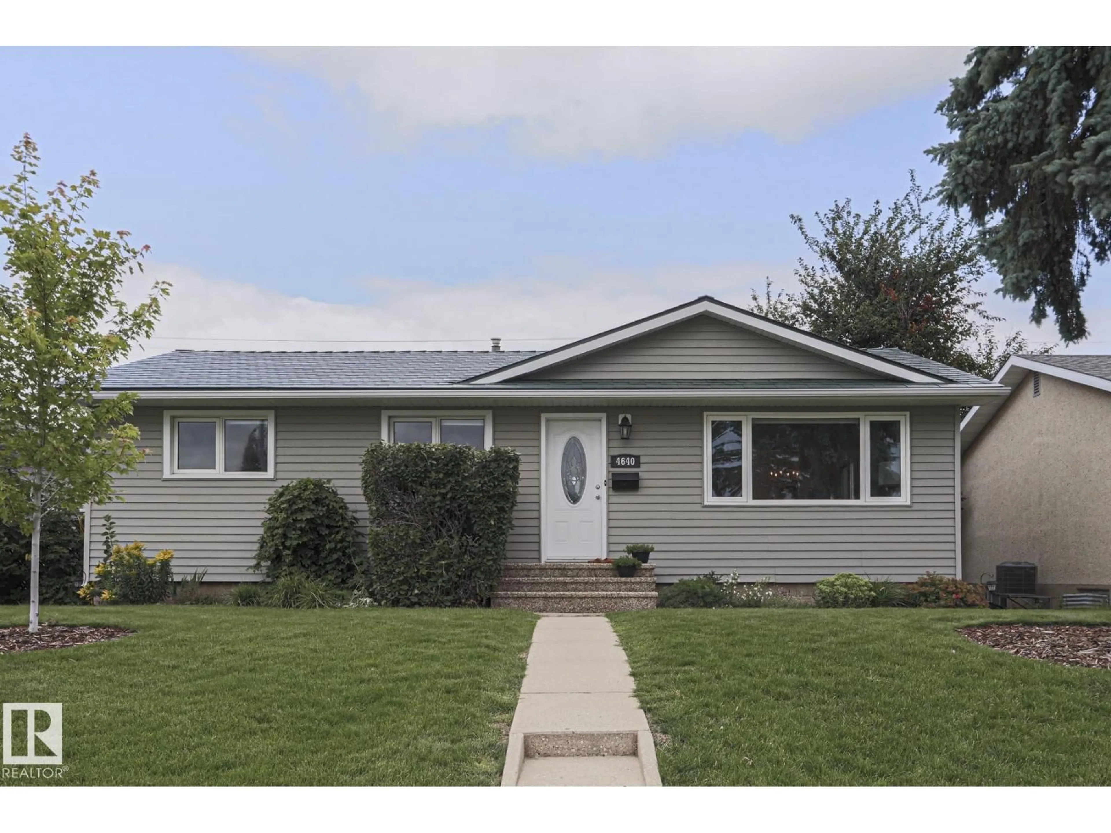 Home with vinyl exterior material, street for 4640 102A AV, Edmonton Alberta T6A0R1