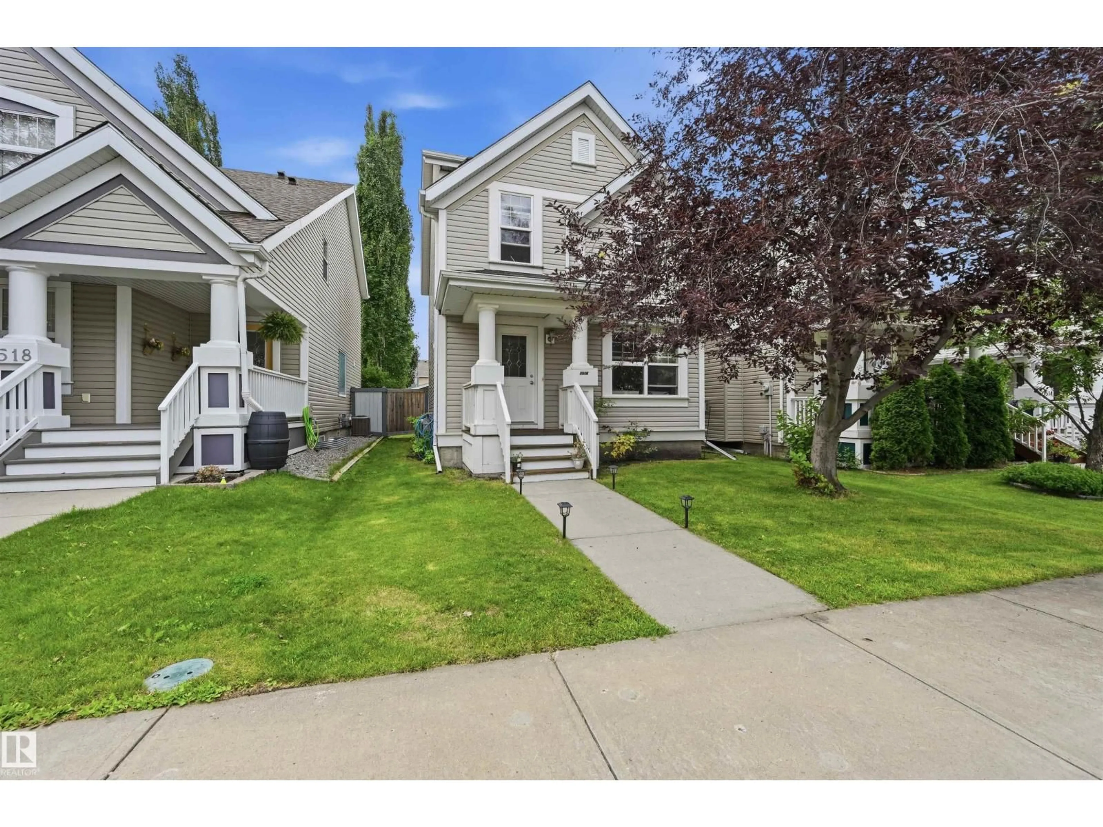 Home with vinyl exterior material, street for 1516 76 ST, Edmonton Alberta T6X1M3