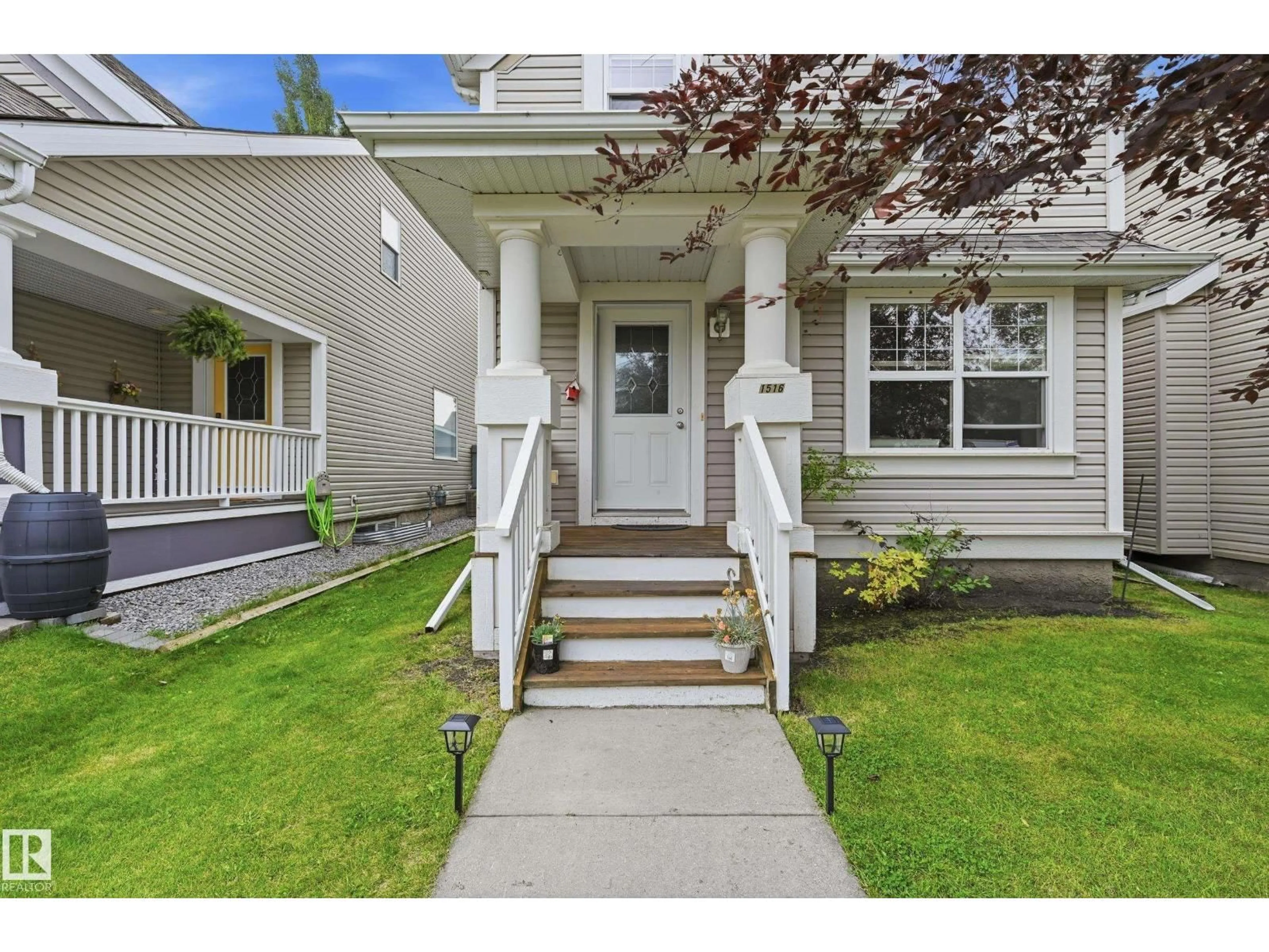 Home with vinyl exterior material, street for 1516 76 ST, Edmonton Alberta T6X1M3