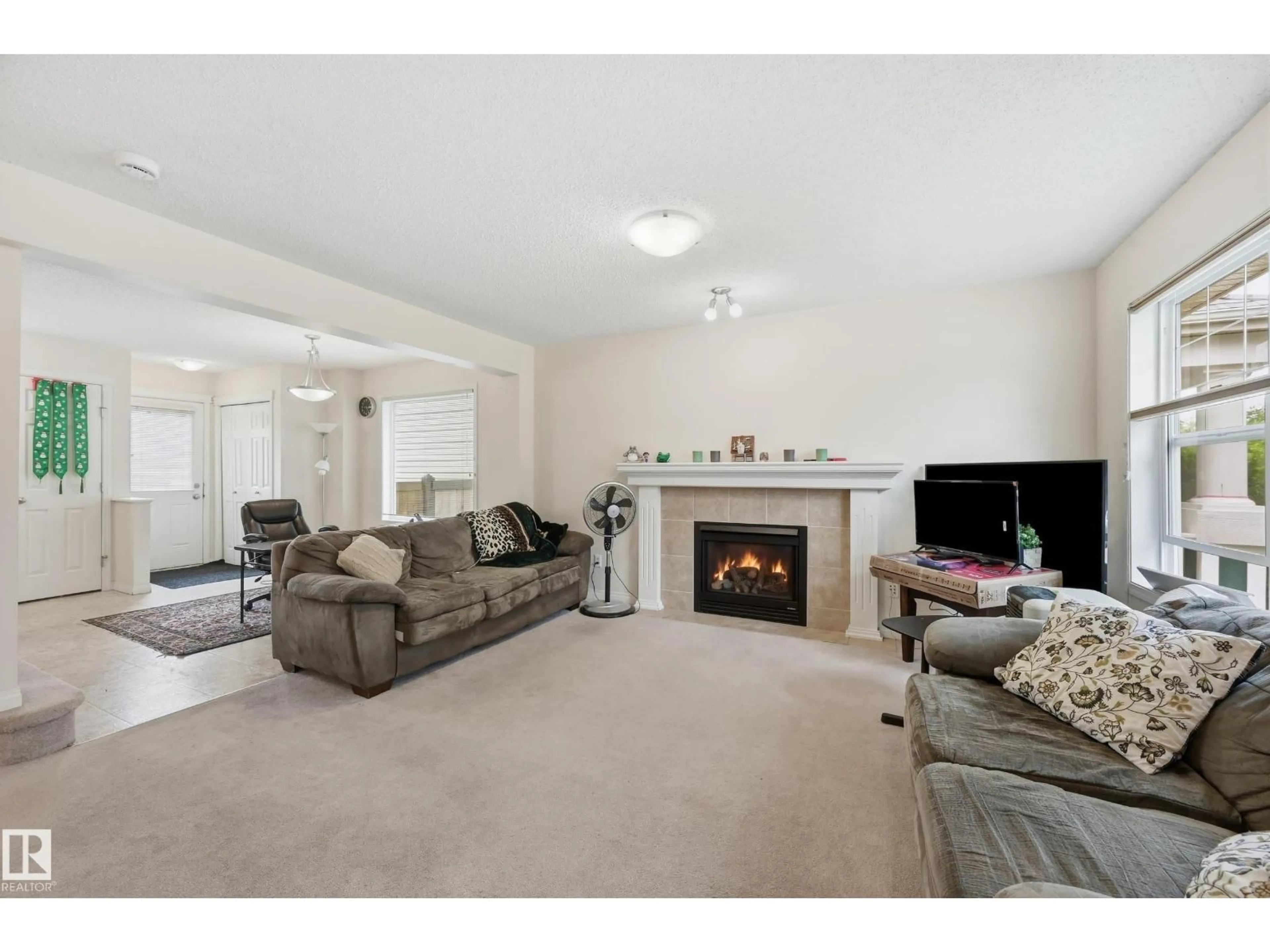 Living room with furniture, carpet floor for 1516 76 ST, Edmonton Alberta T6X1M3