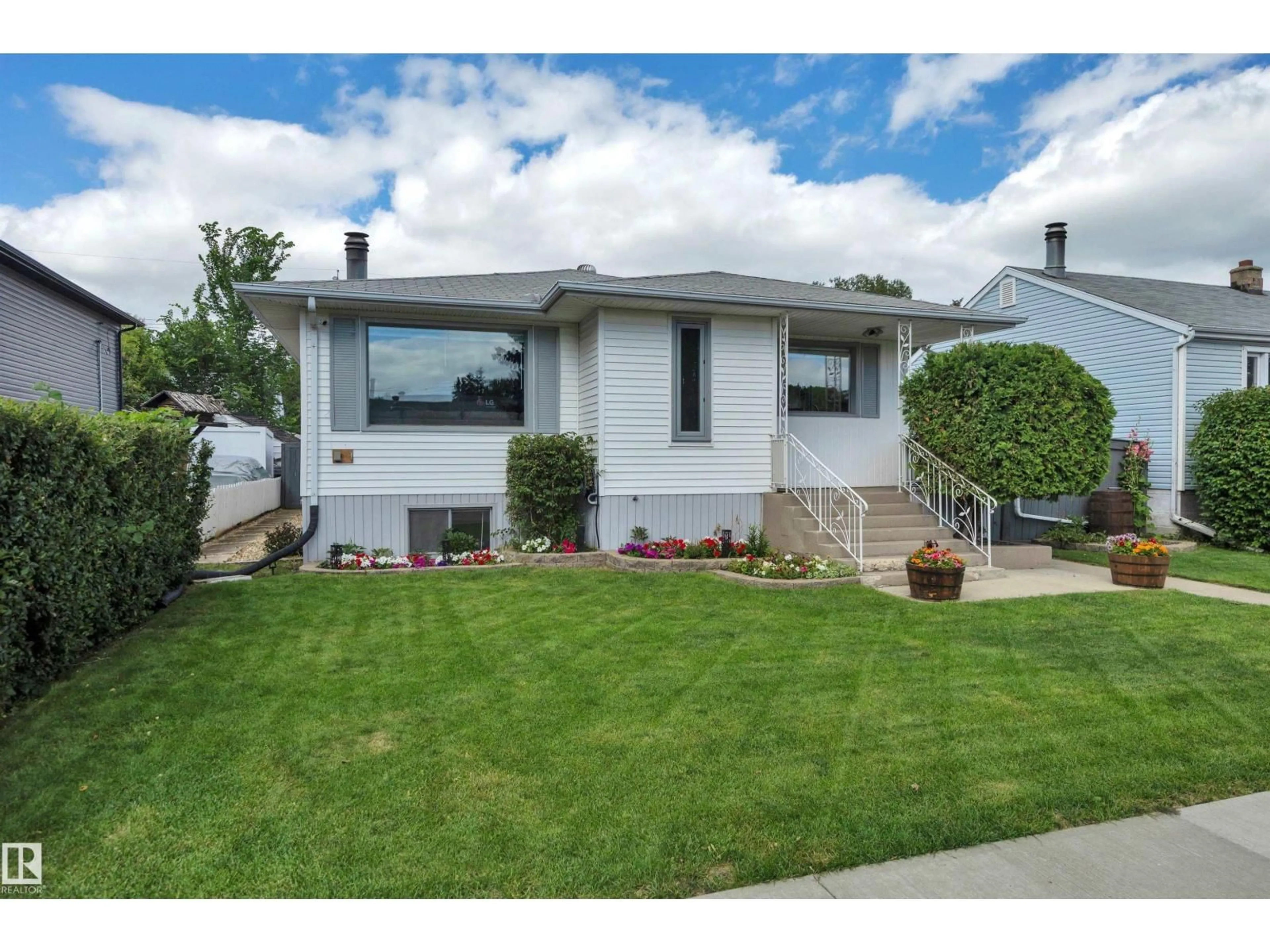 Home with vinyl exterior material, street for 5116 47 AV, Leduc Alberta T9E5C5