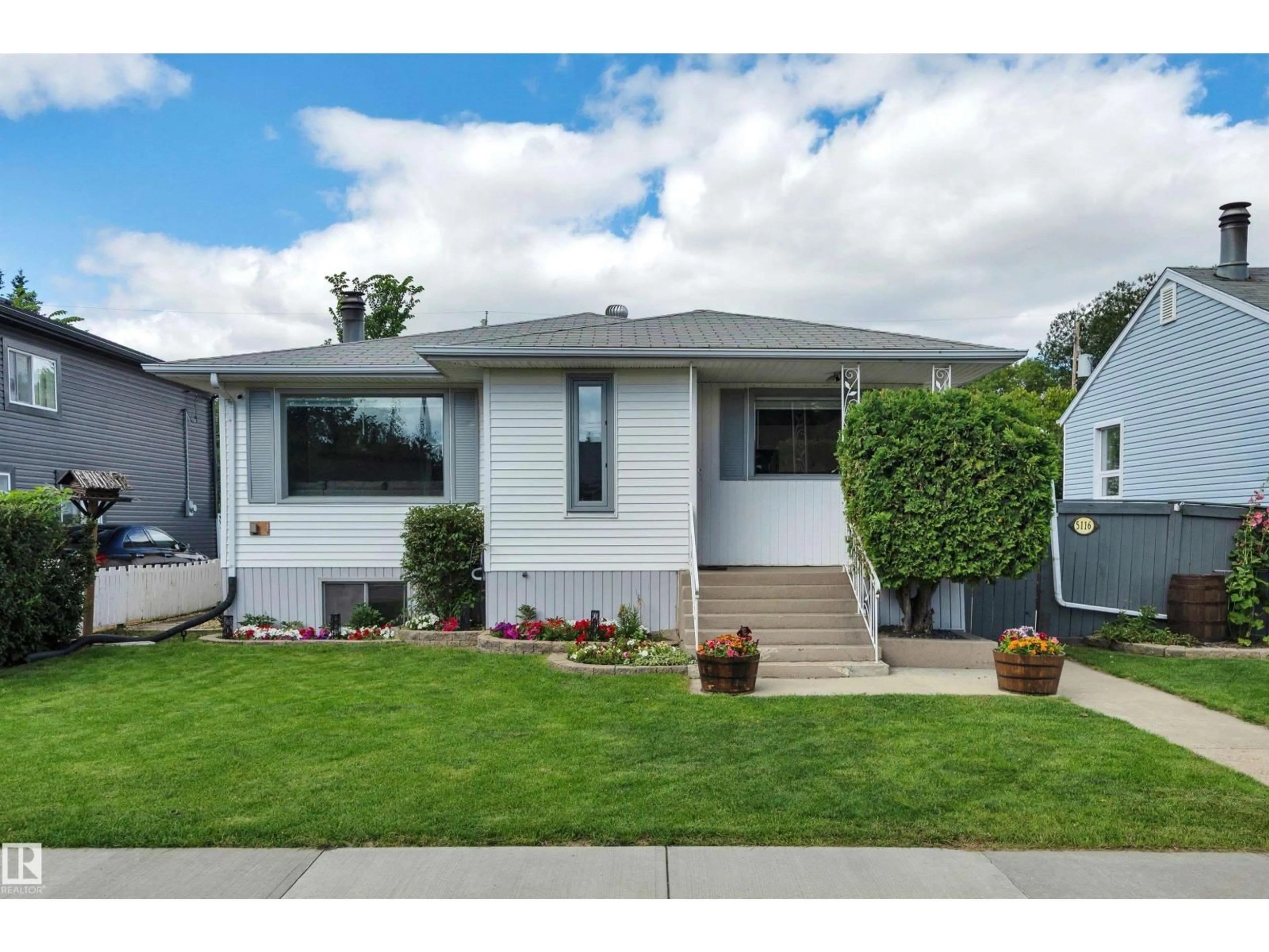 Home with vinyl exterior material, street for 5116 47 AV, Leduc Alberta T9E5C5