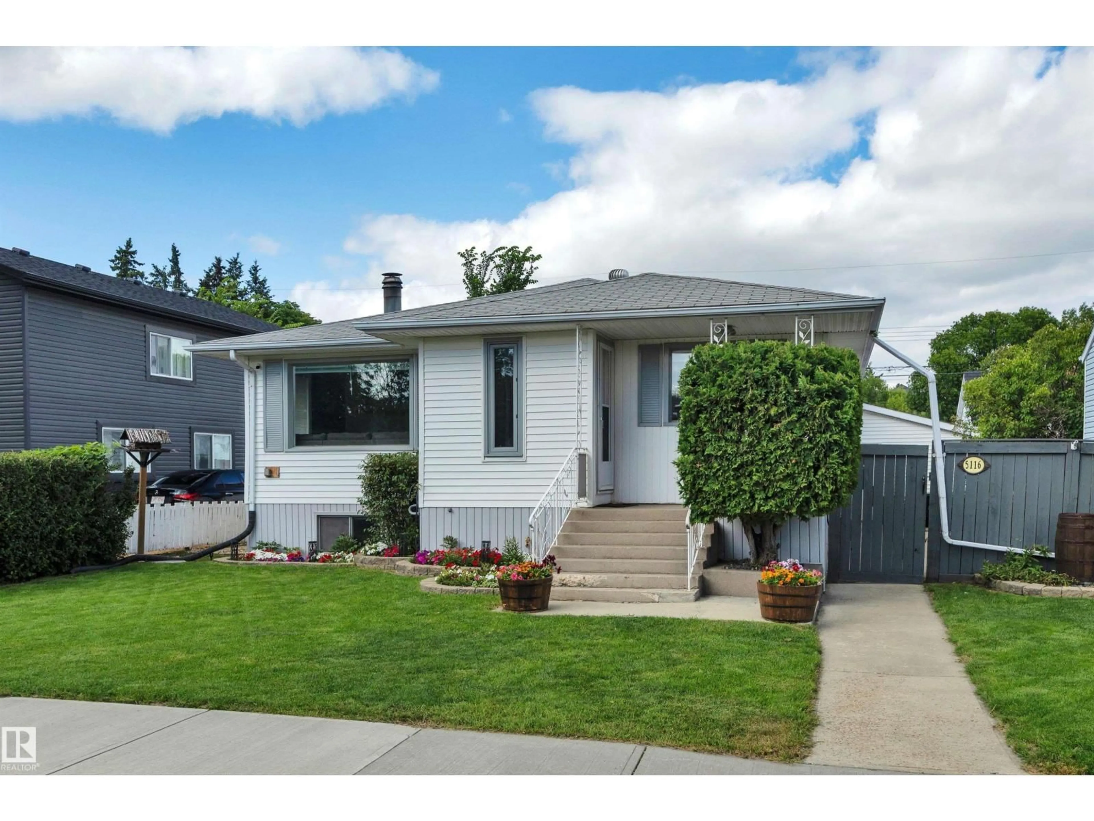 Home with vinyl exterior material, street for 5116 47 AV, Leduc Alberta T9E5C5