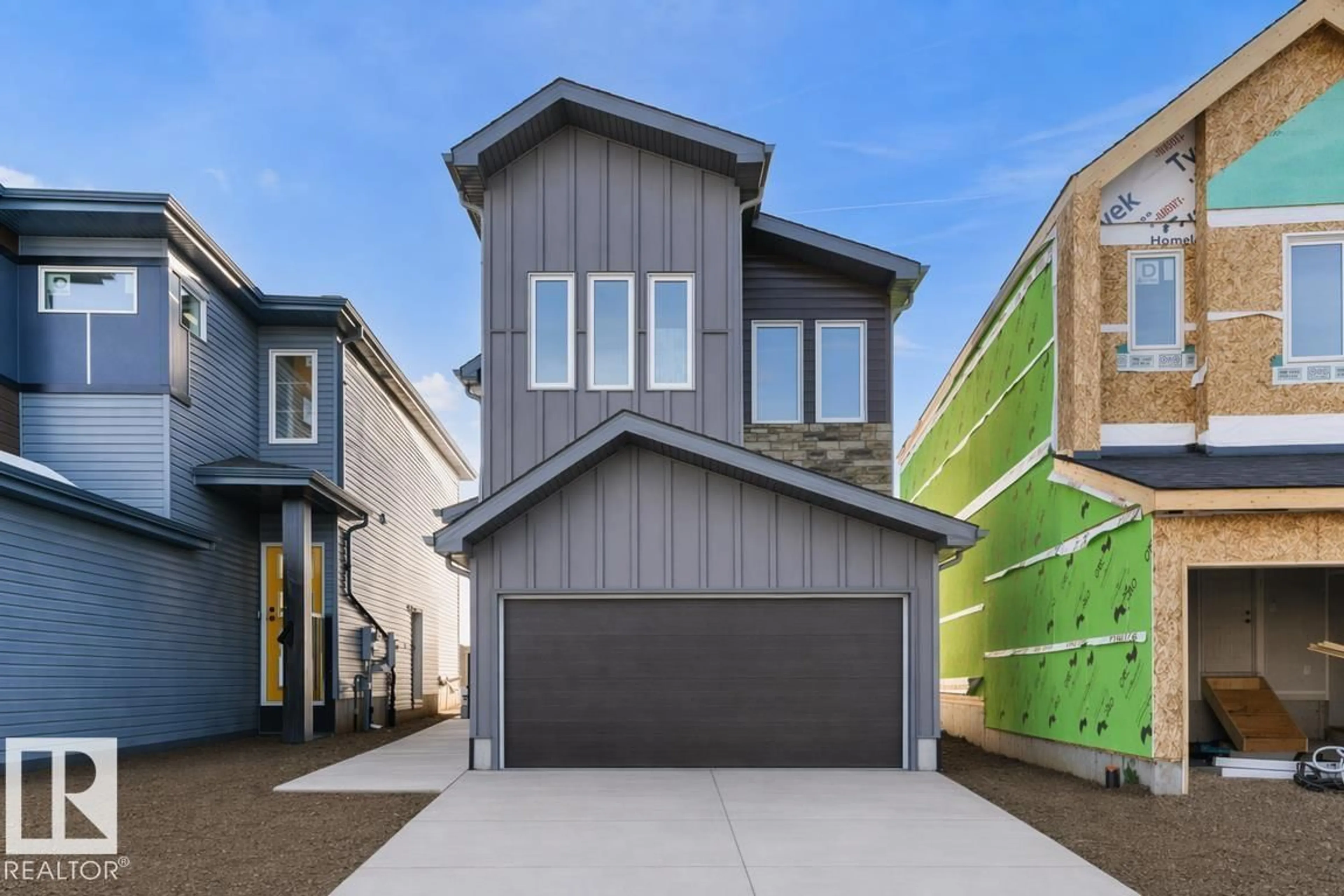 Home with vinyl exterior material, street for NW - 19107 20 AV, Edmonton Alberta T6M3E8