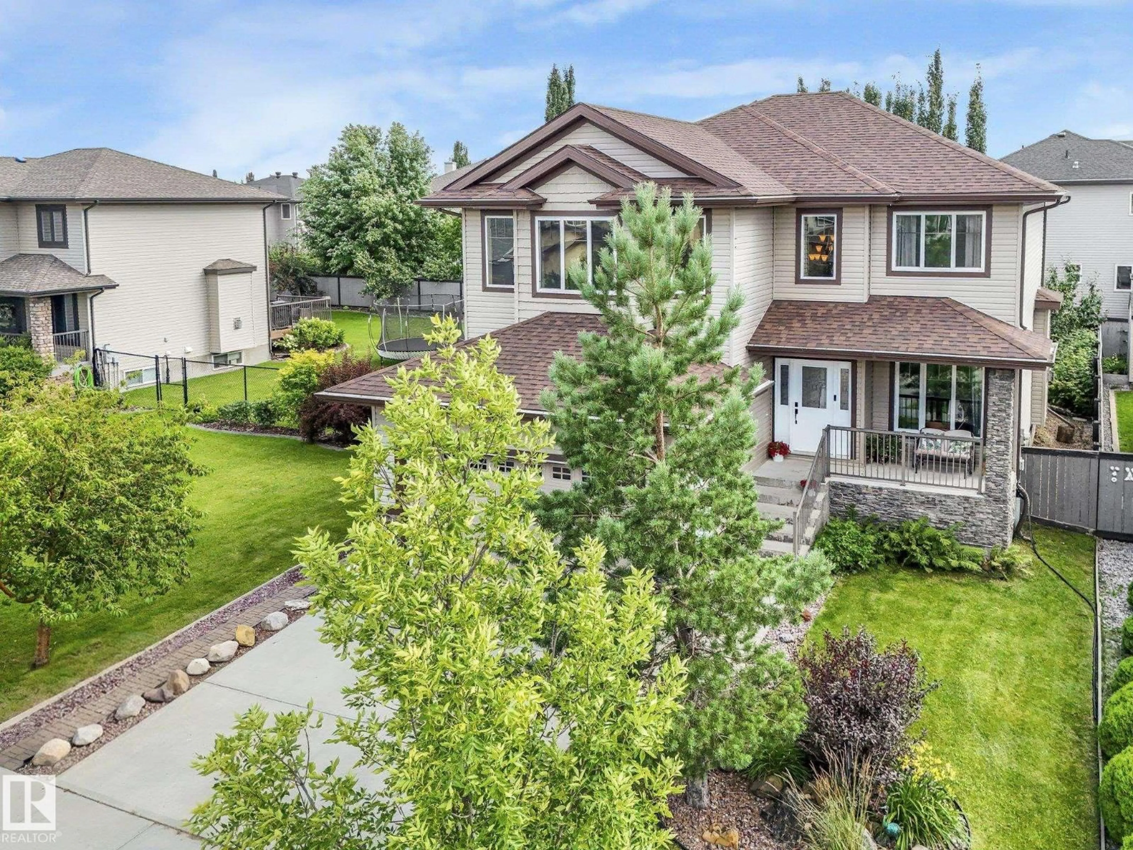 A pic from outside/outdoor area/front of a property/back of a property/a pic from drone, mountain view for 30 SHOREWOOD CR, Leduc Alberta T9E0K9