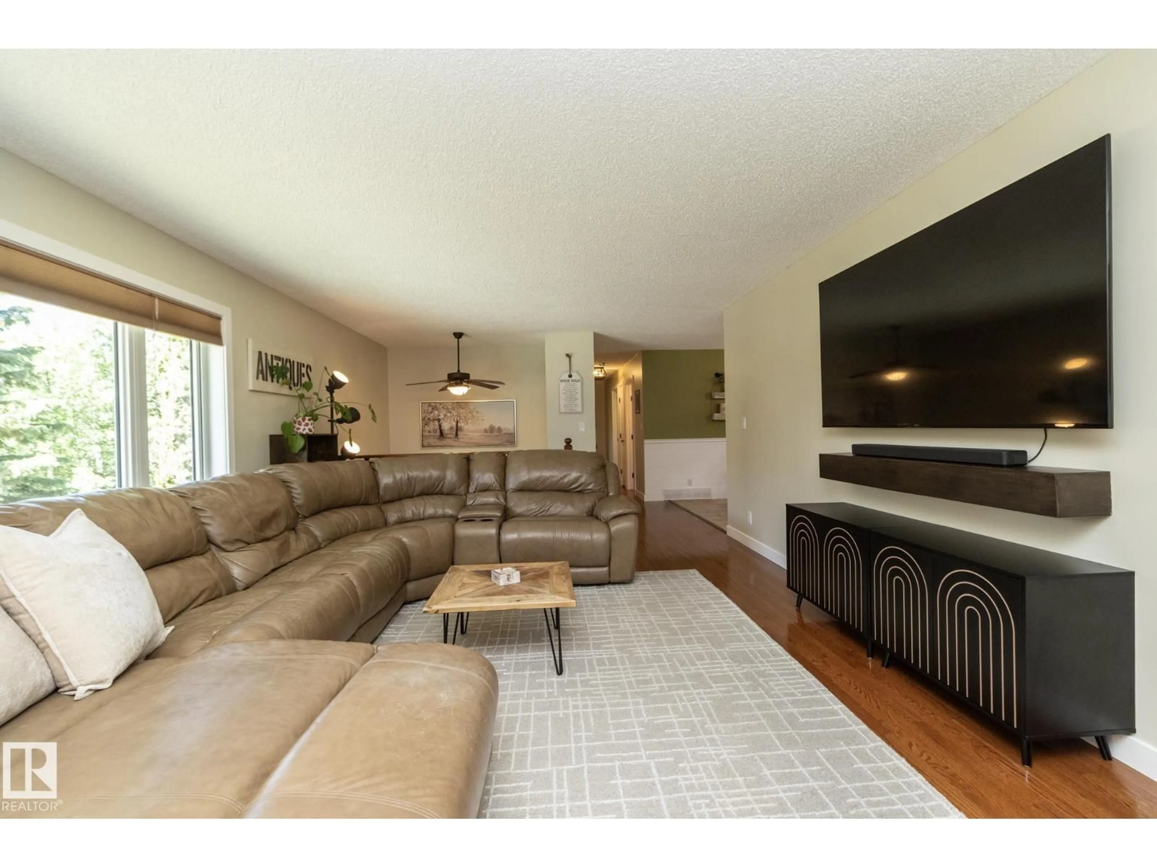 Living room with furniture, wood/laminate floor for #40 - 2022 PARKLAND DR, Rural Parkland County Alberta T7Y2S1