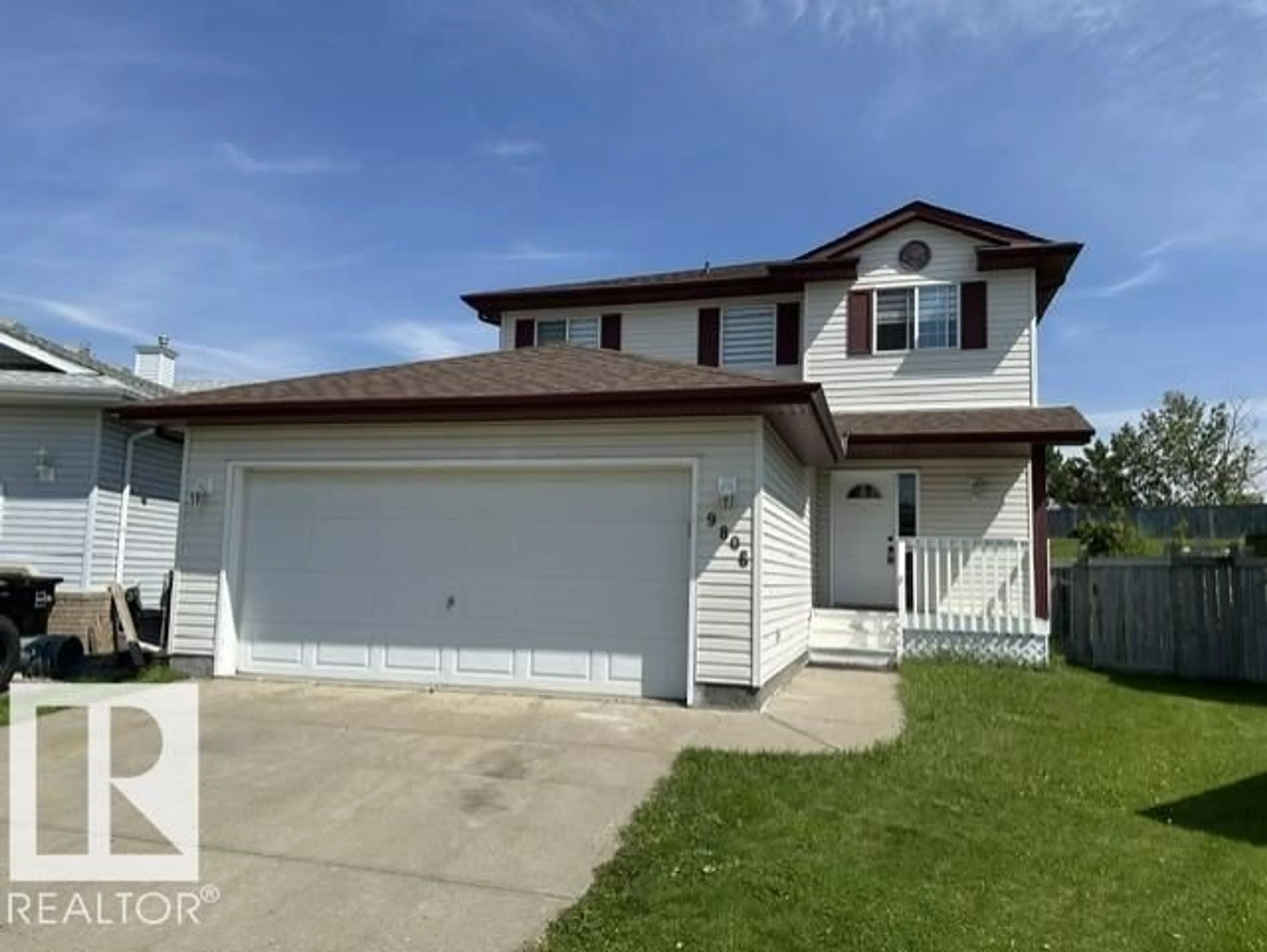 Home with vinyl exterior material, street for 9806 179 AV, Edmonton Alberta T5X6A6