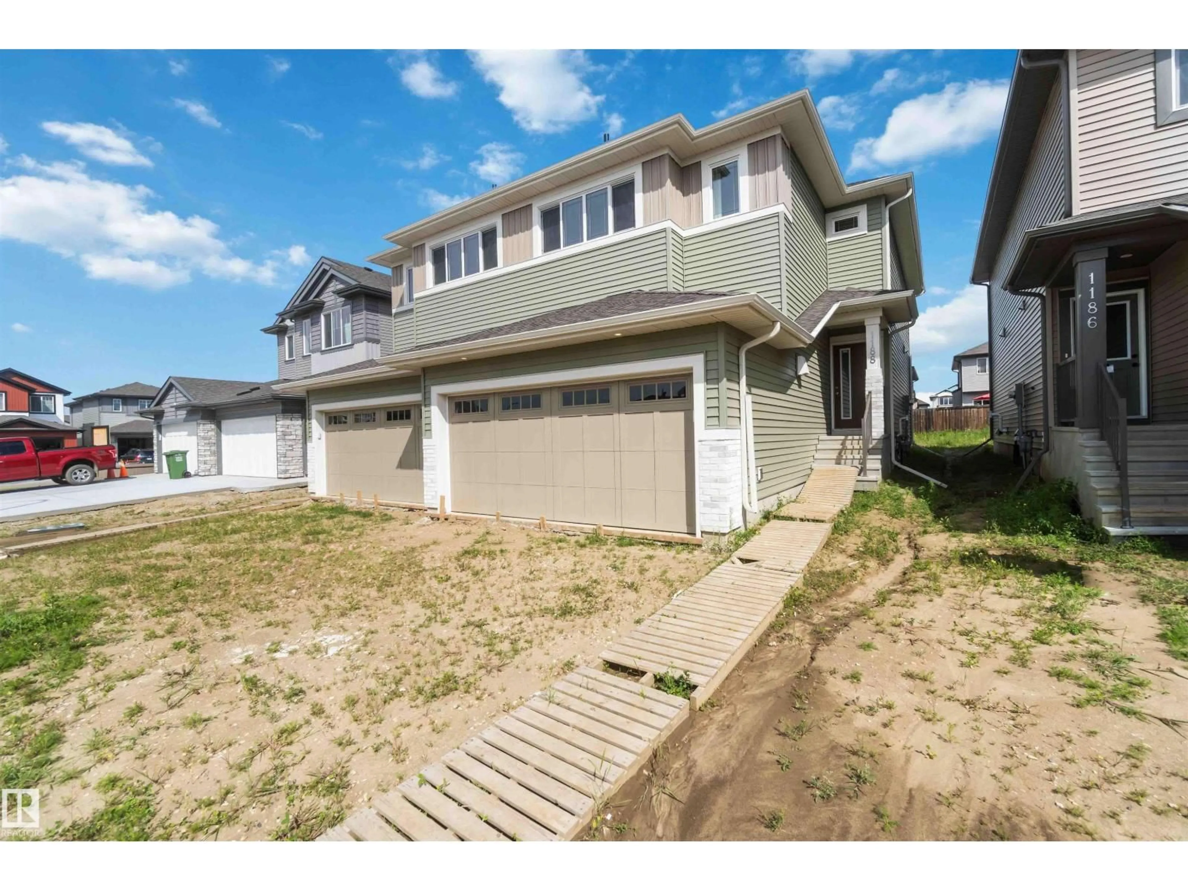 A pic from outside/outdoor area/front of a property/back of a property/a pic from drone, street for 1188 SOUTH CREEK WD, Stony Plain Alberta T7Z0P5