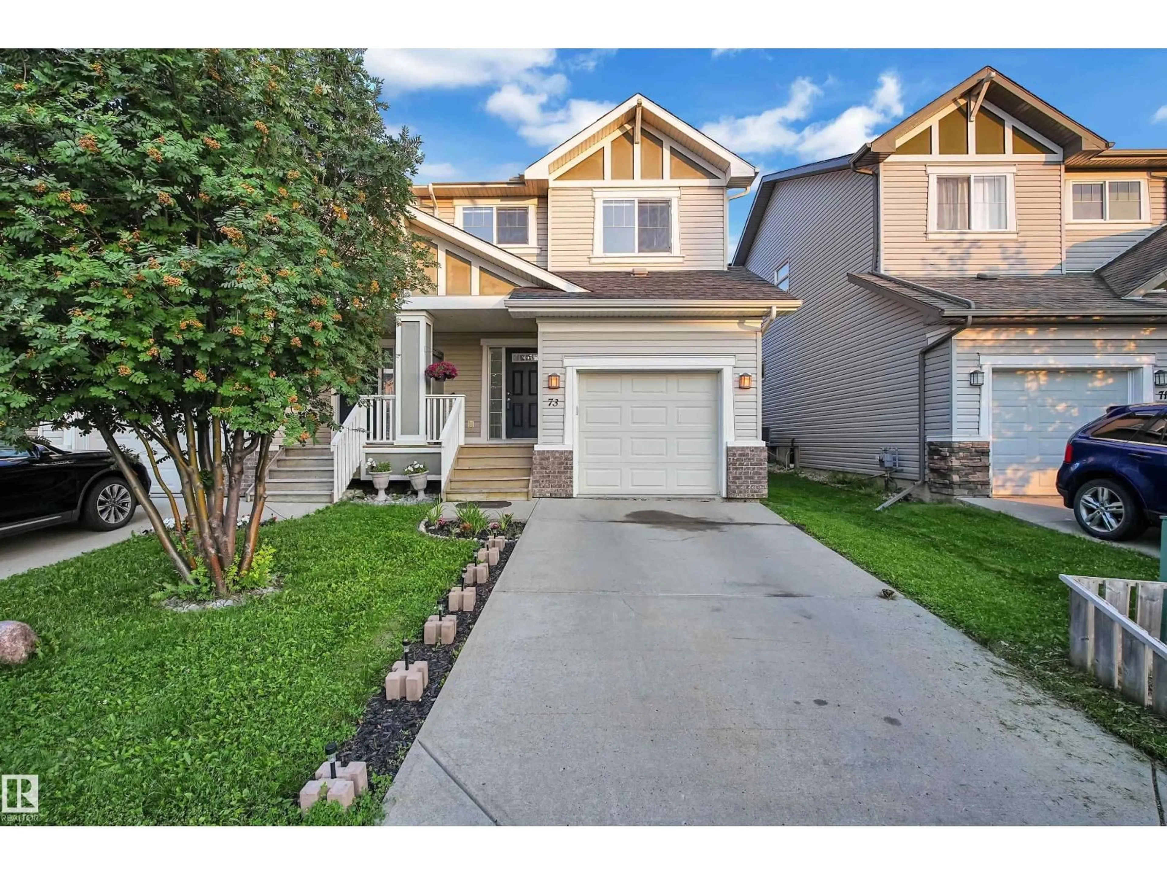 Home with vinyl exterior material, street for 73 HARTWICK LO, Spruce Grove Alberta T7X0A5