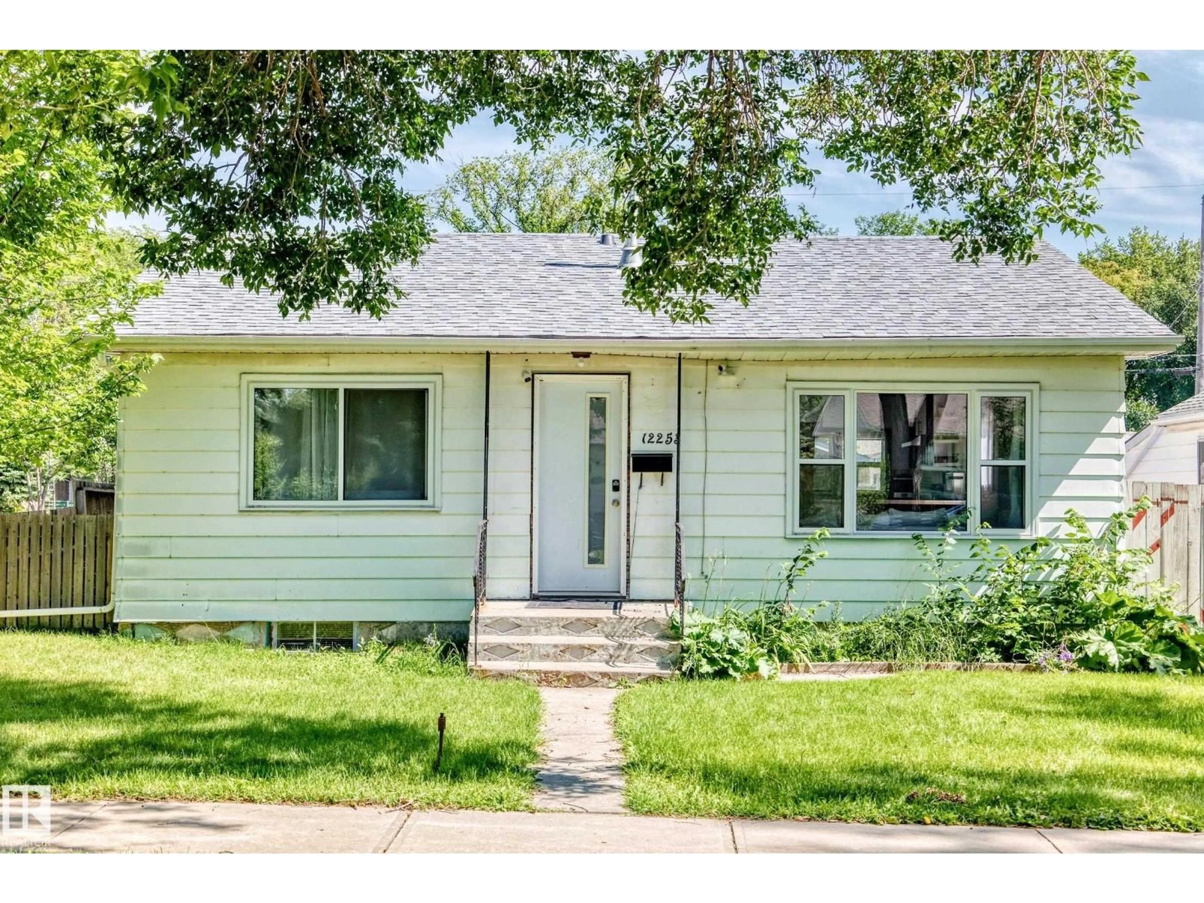 Home with vinyl exterior material, street for 12253 94 ST, Edmonton Alberta T5G1K2