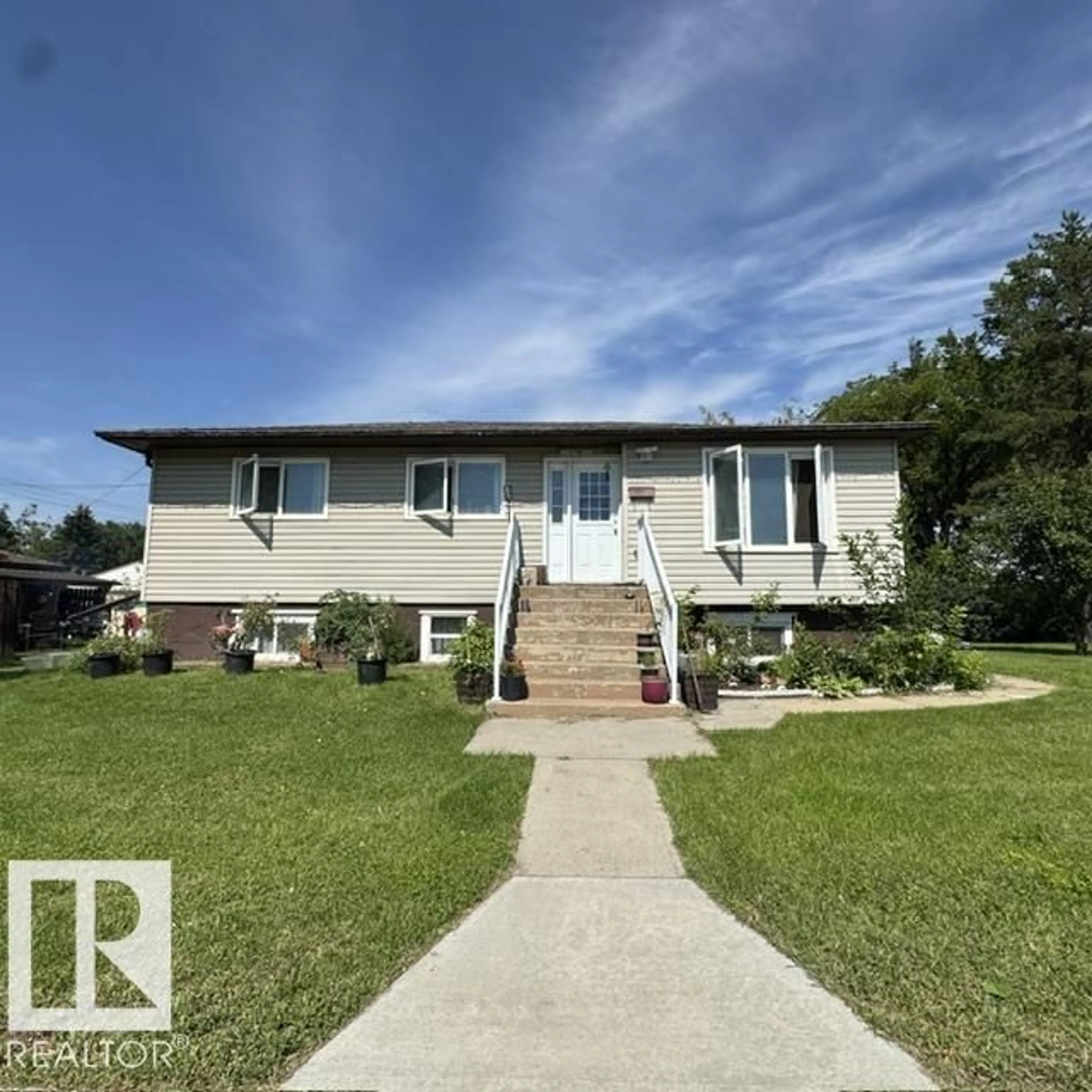 Home with vinyl exterior material, street for 11404 127 AV, Edmonton Alberta T5E0C6