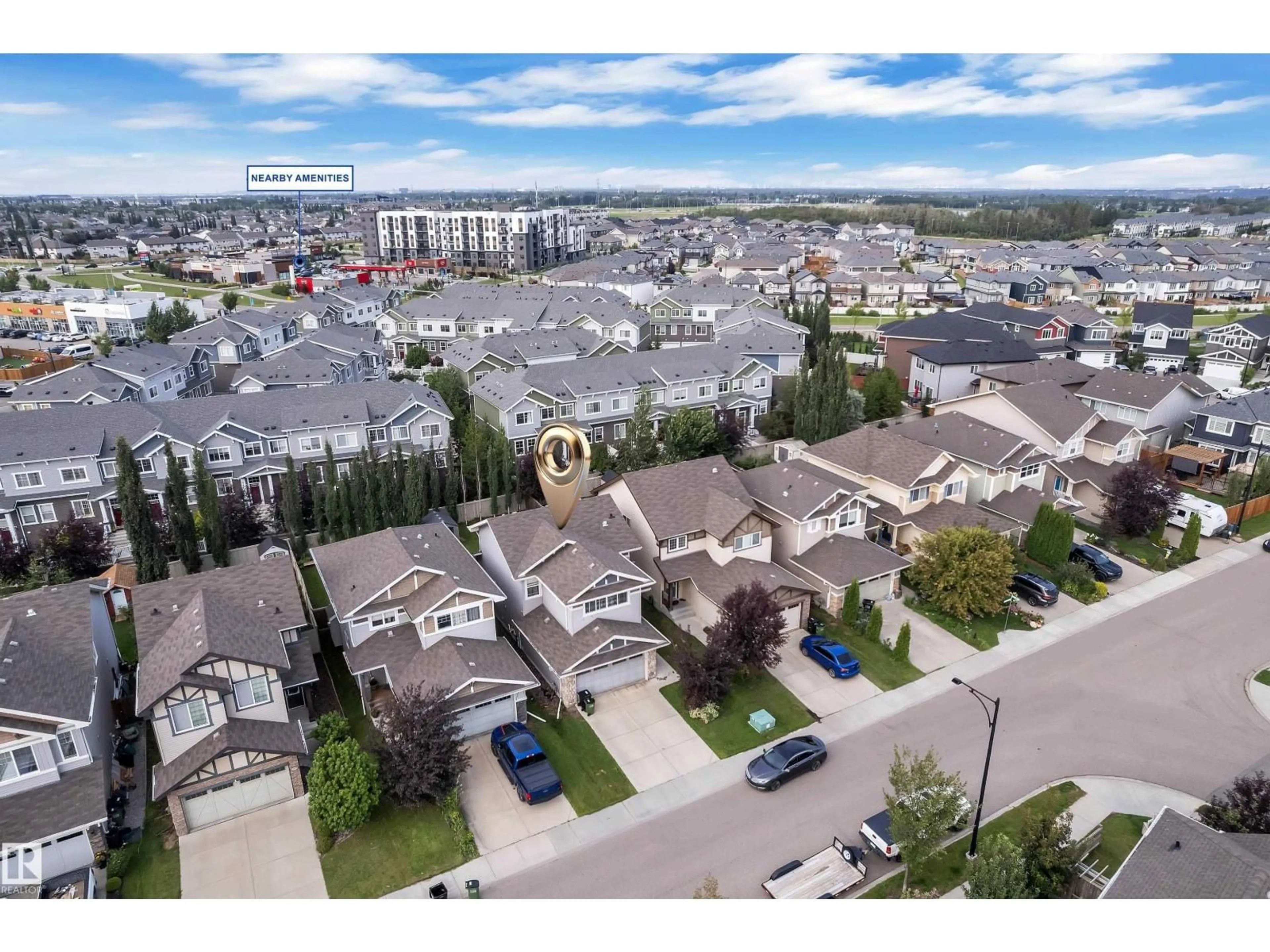 A pic from outside/outdoor area/front of a property/back of a property/a pic from drone, mountain view for NW - 6945 EVANS WD, Edmonton Alberta T6M0P9