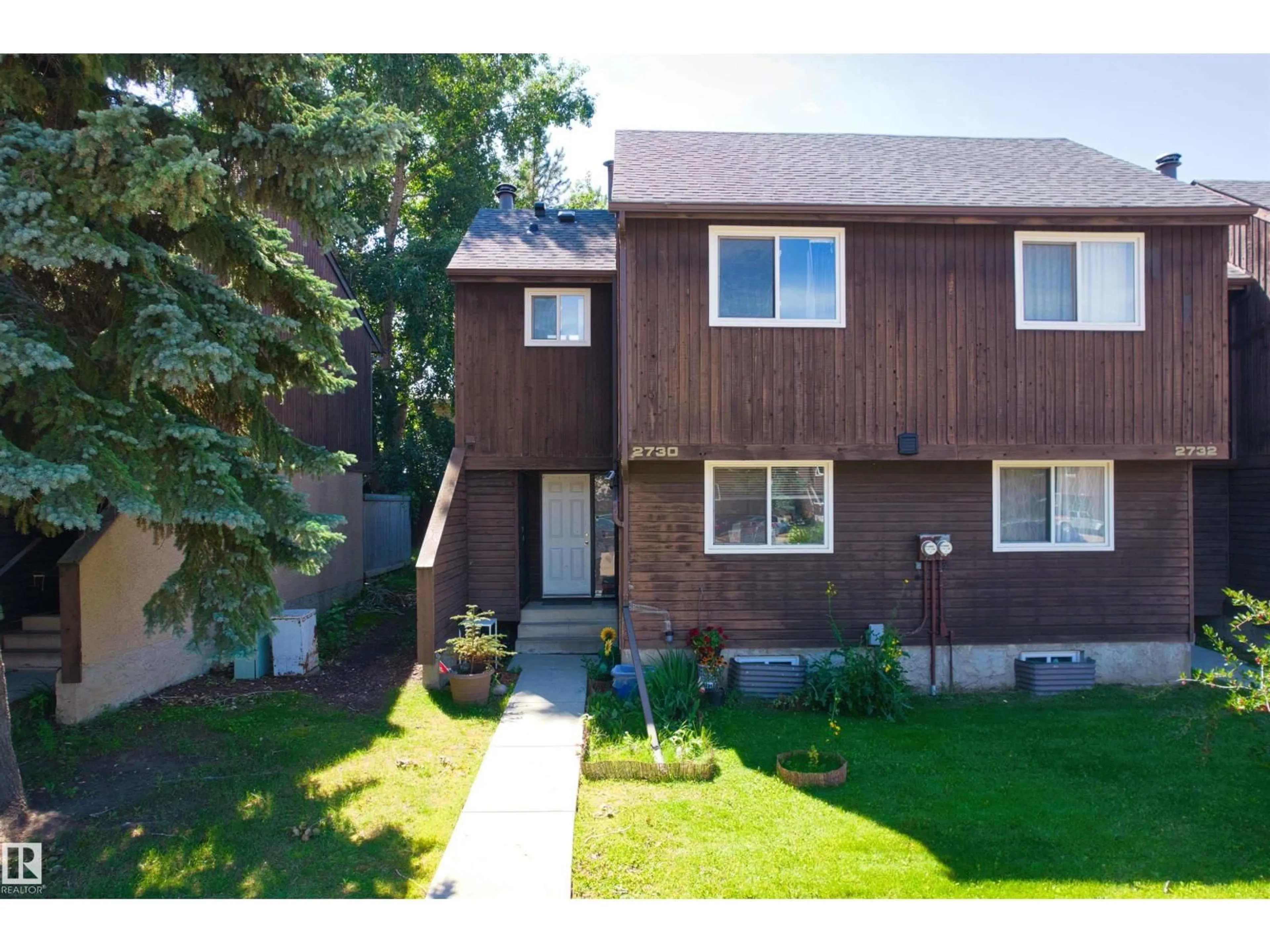 Home with vinyl exterior material, street for NW - 2730 105 ST, Edmonton Alberta T6J4J3
