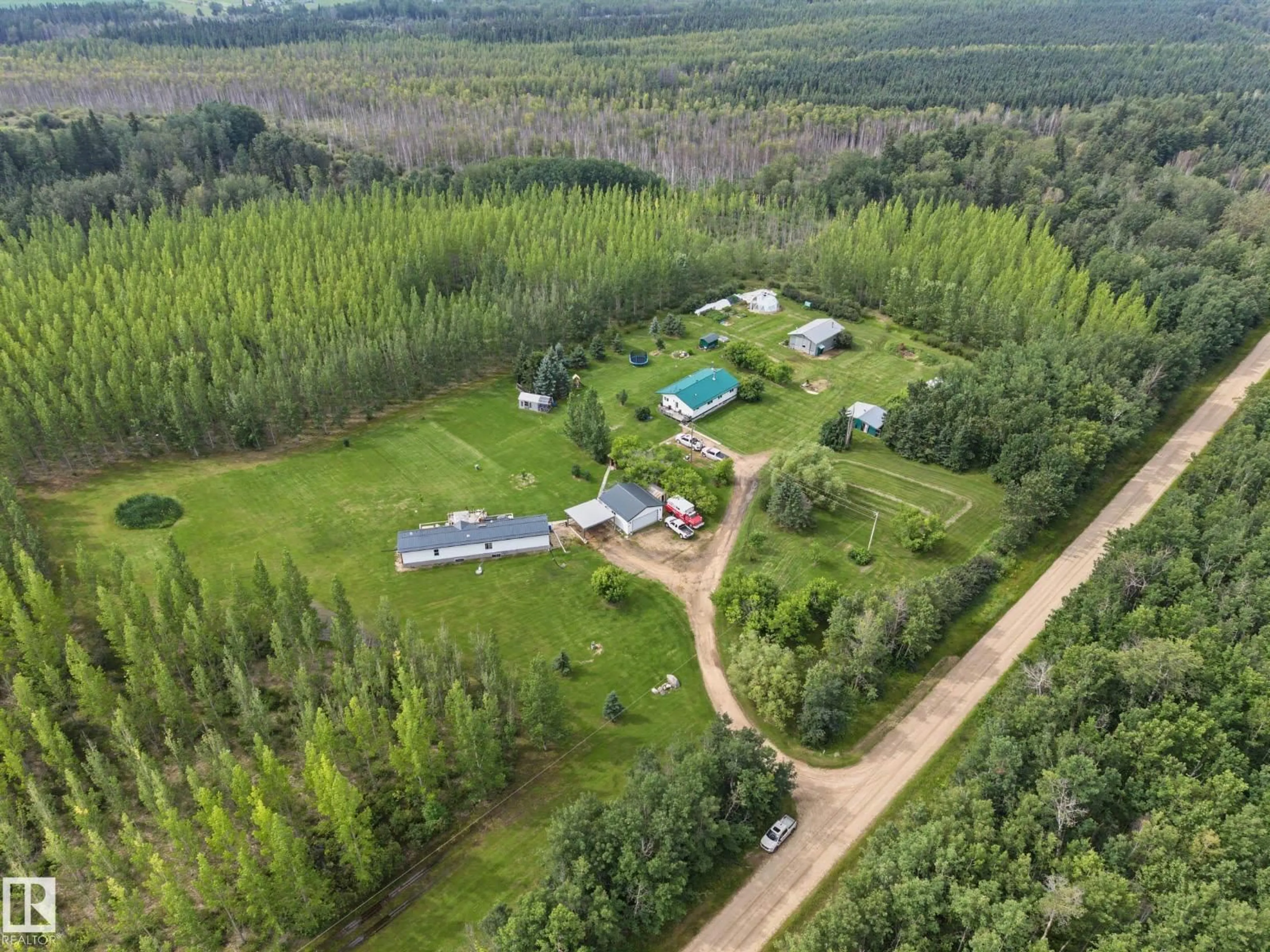 A pic from outside/outdoor area/front of a property/back of a property/a pic from drone, forest/trees view for 3025A TWP ROAD 562, Rural Lac Ste. Anne County Alberta T0E1A0