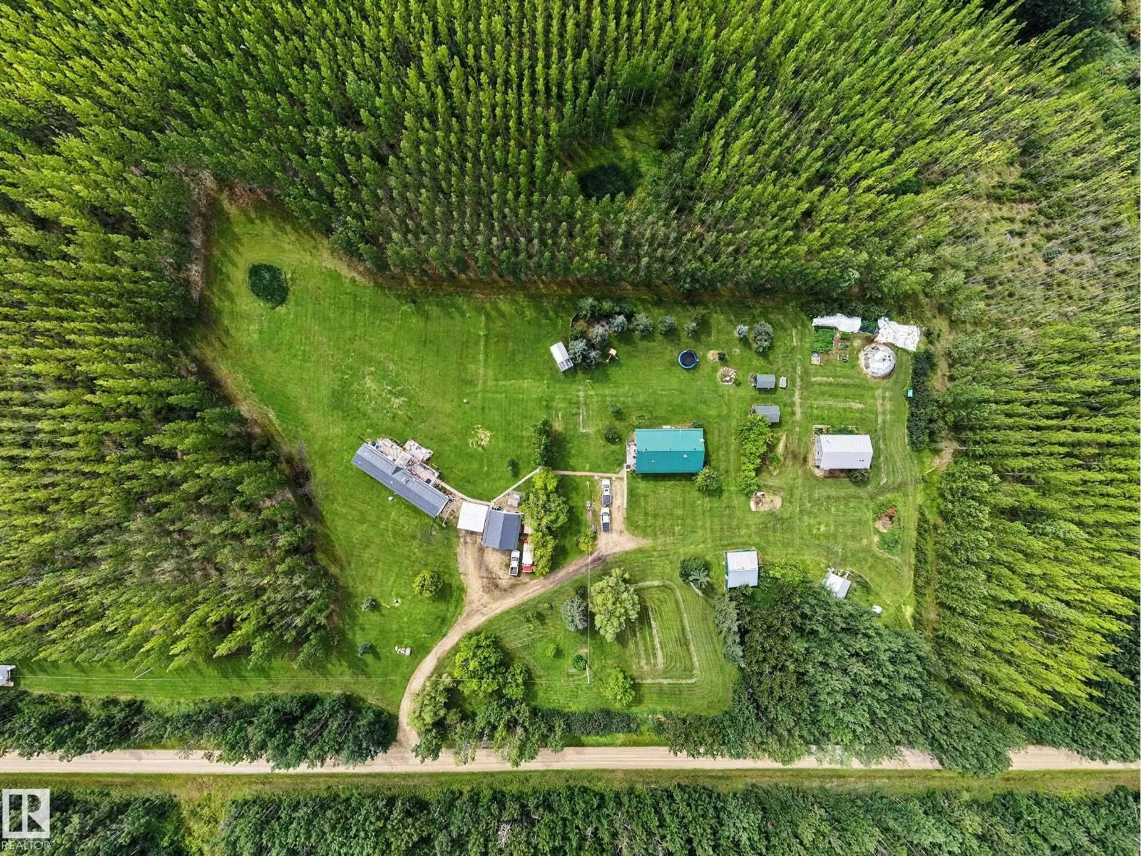 A pic from outside/outdoor area/front of a property/back of a property/a pic from drone, forest/trees view for 3025A TWP ROAD 562, Rural Lac Ste. Anne County Alberta T0E1A0