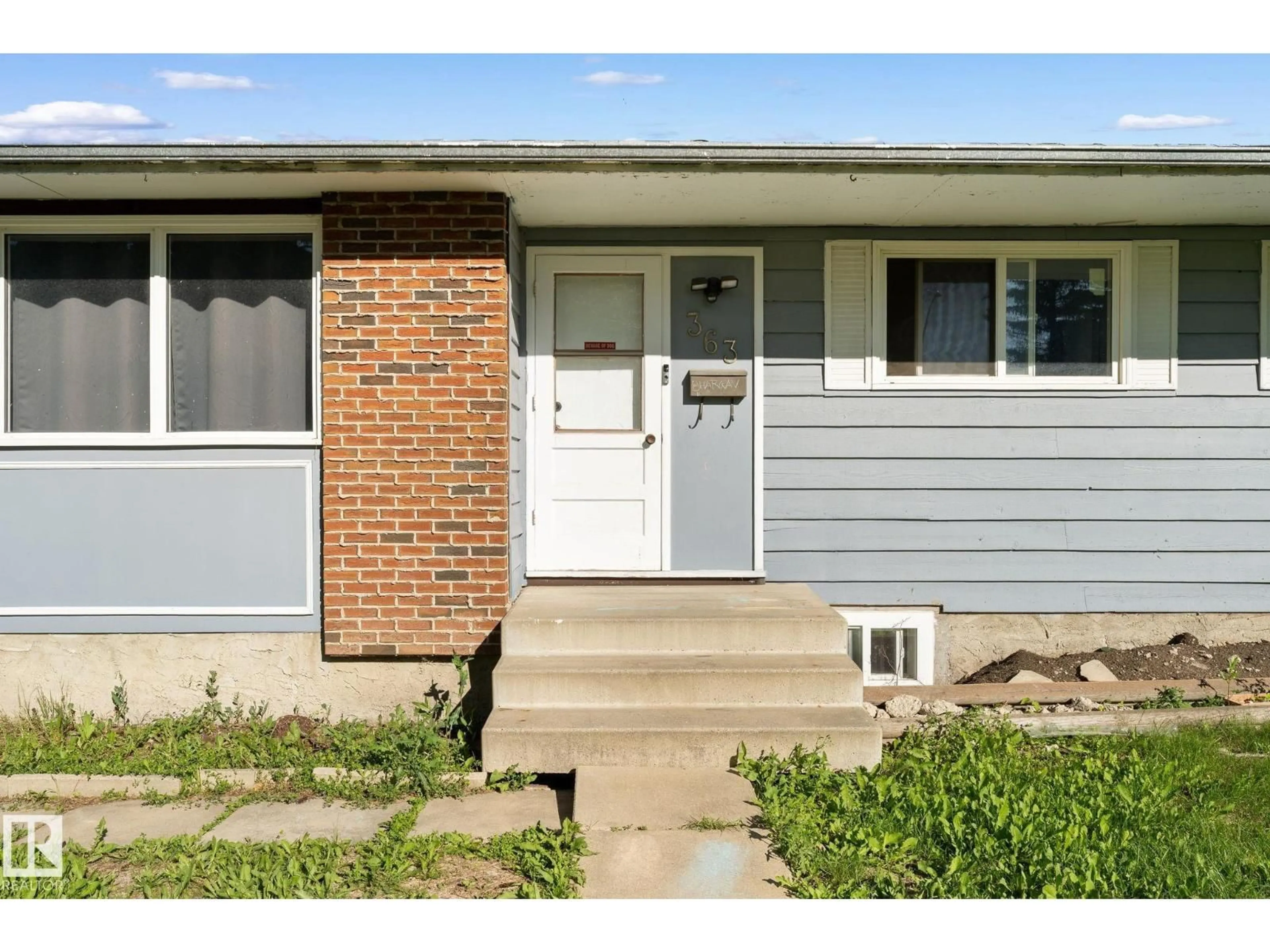 Home with vinyl exterior material, street for 363 KNOTTWOOD RD, Edmonton Alberta T6K2G4