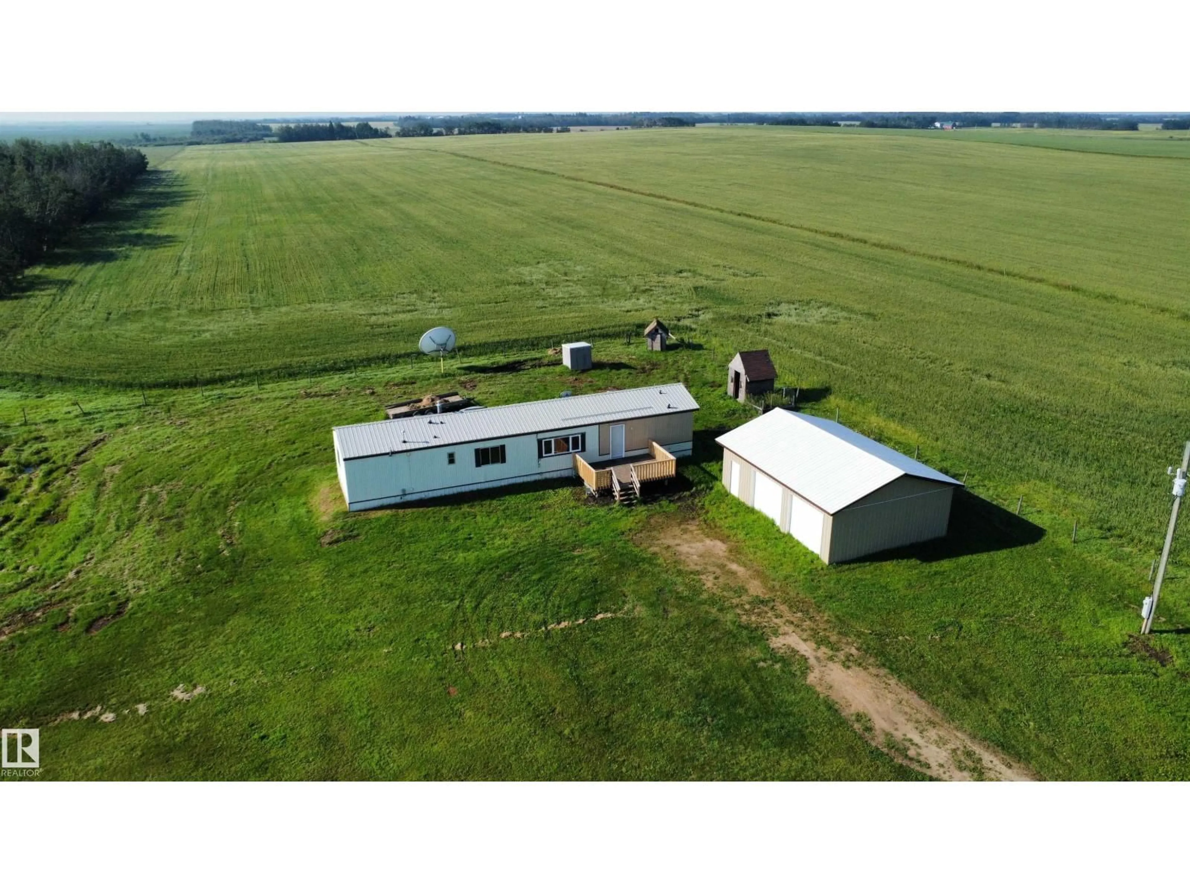 A pic from outside/outdoor area/front of a property/back of a property/a pic from drone, building for 26417 TWP RD 582, Rural Westlock County Alberta T0G1W0