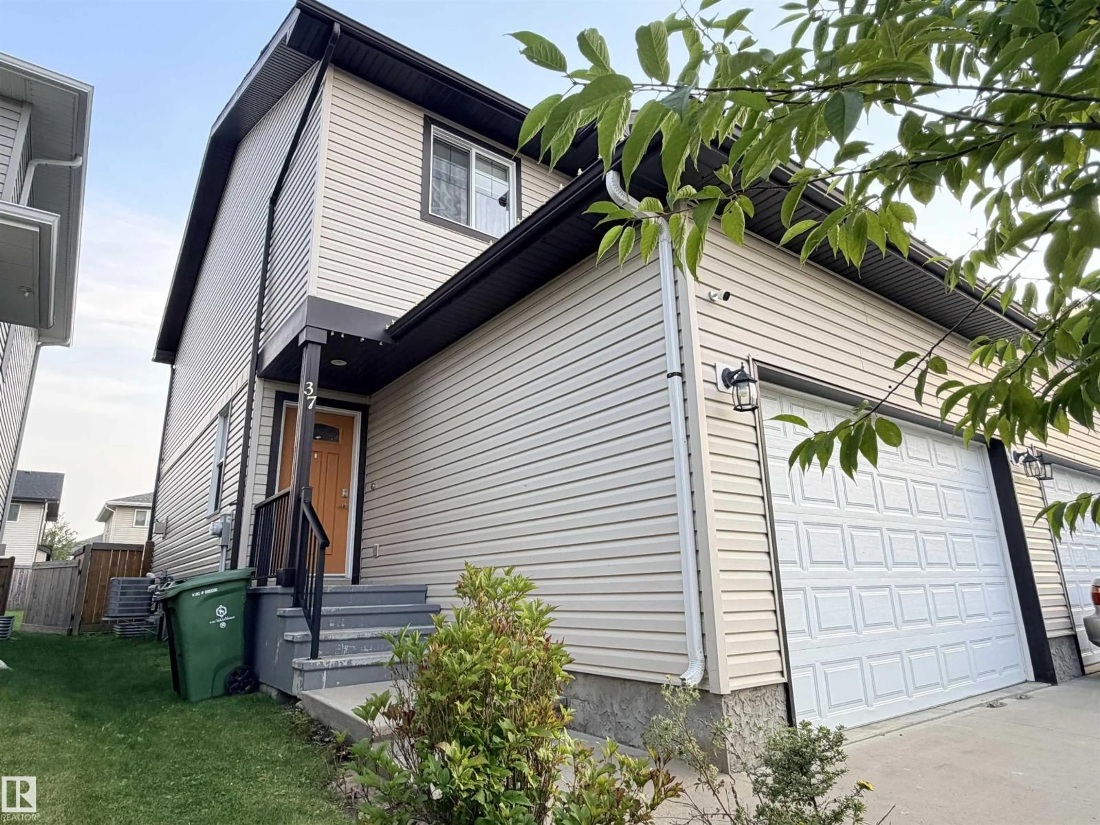Home with vinyl exterior material, street for 37 ROSEBERRY LN, Fort Saskatchewan Alberta T8L0M6
