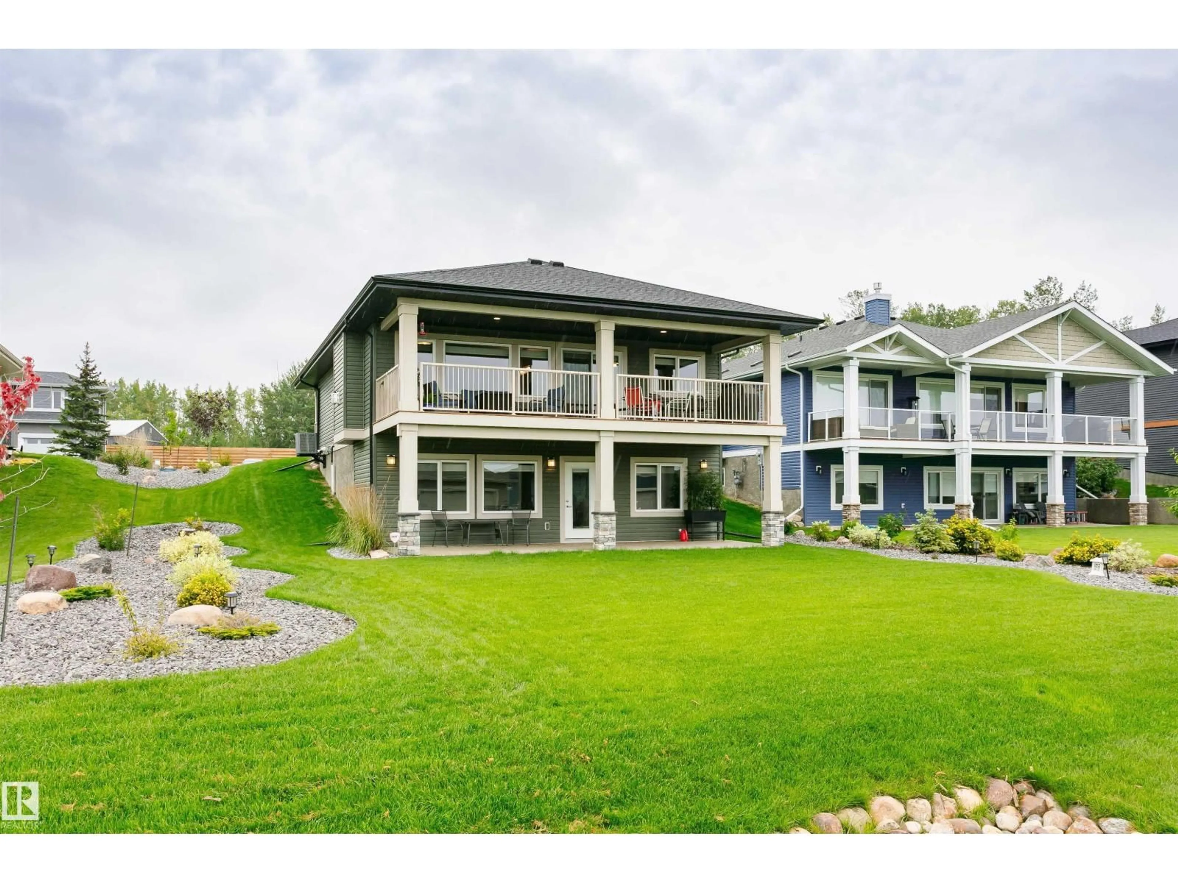 A pic from outside/outdoor area/front of a property/back of a property/a pic from drone, water/lake/river/ocean view for STE - 212 ANNE TR, Rural Lac Ste. Anne County Alberta T0E1A1