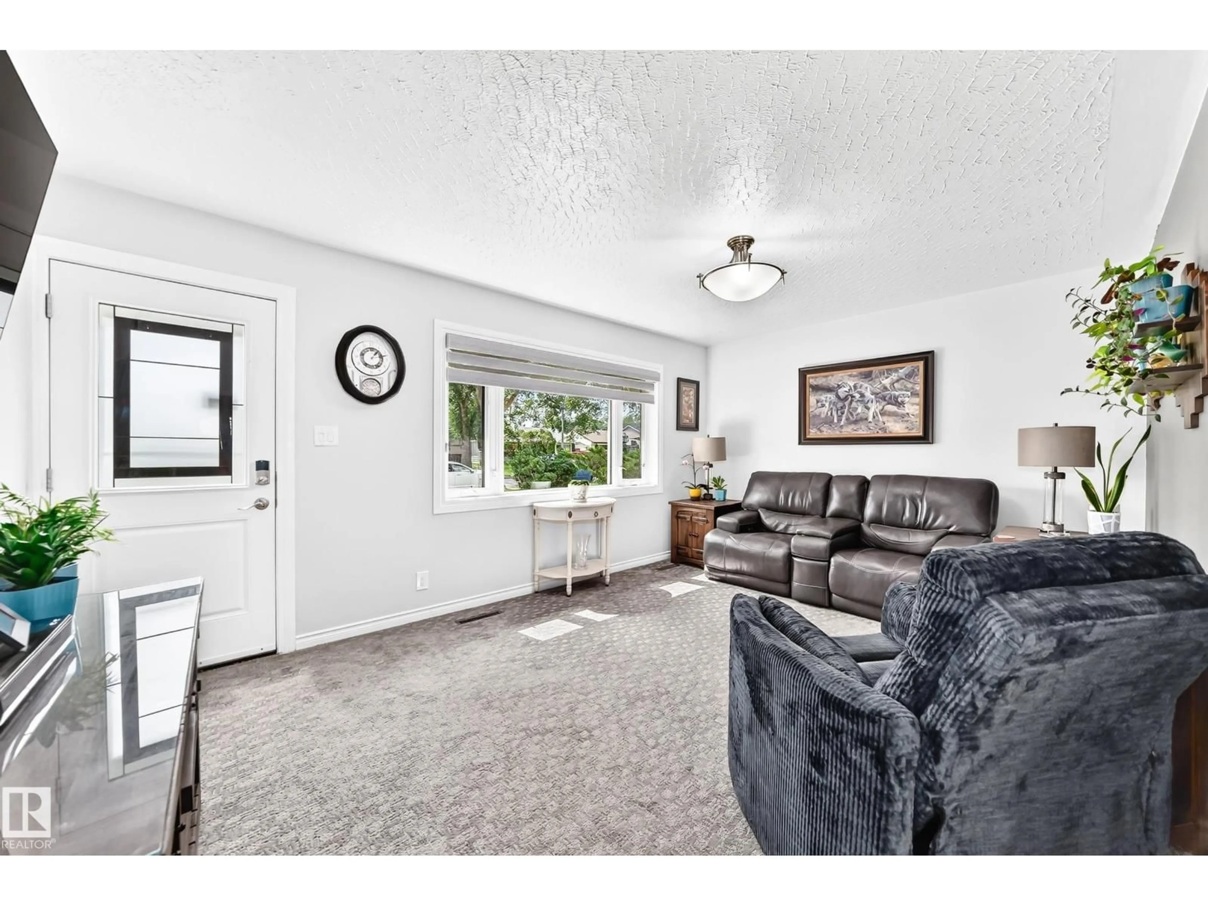 Living room with furniture, unknown for 10524 128 AV, Edmonton Alberta T5E0J3