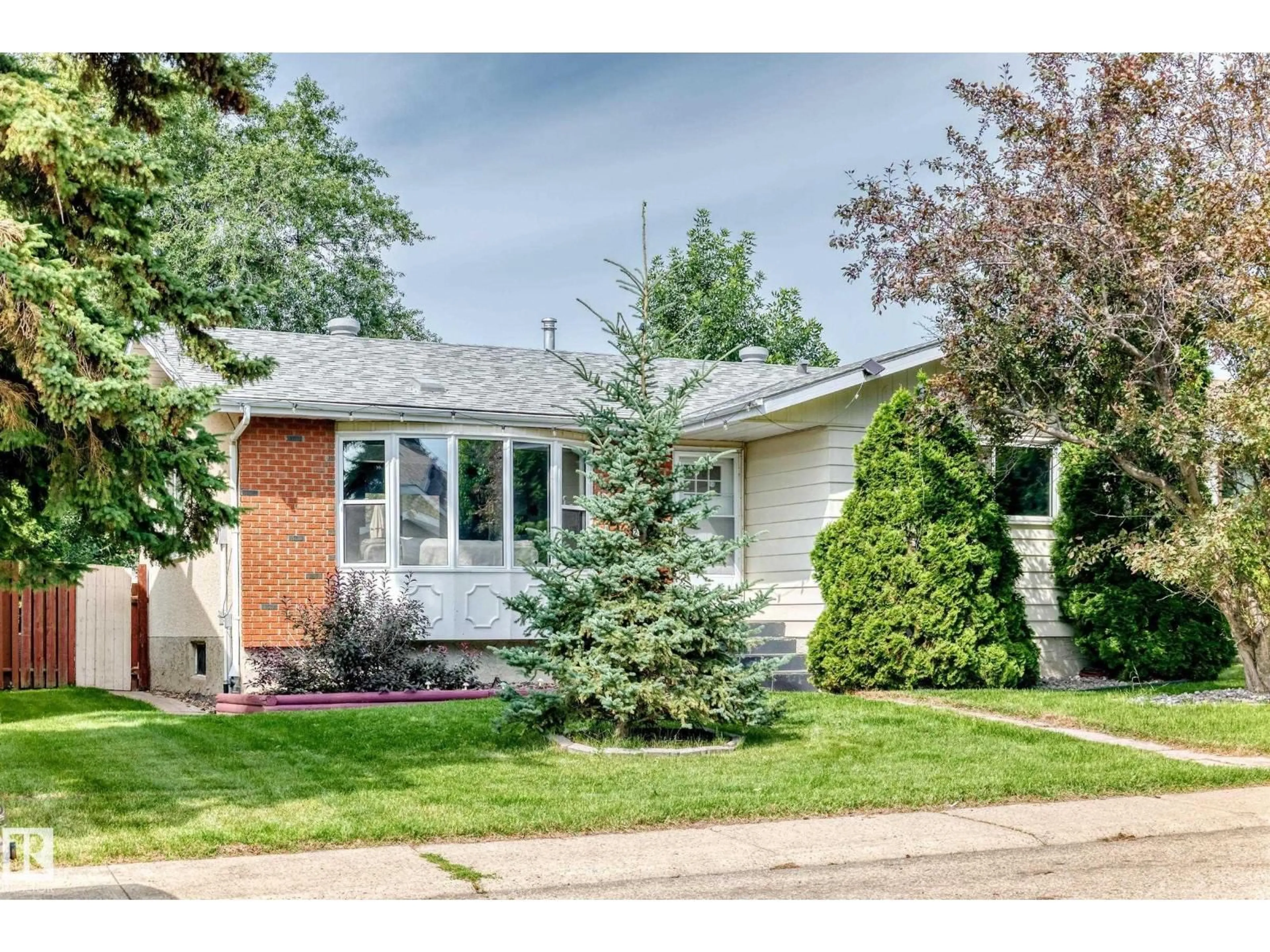 Home with vinyl exterior material, street for 2112 36 ST, Edmonton Alberta T6L3G4
