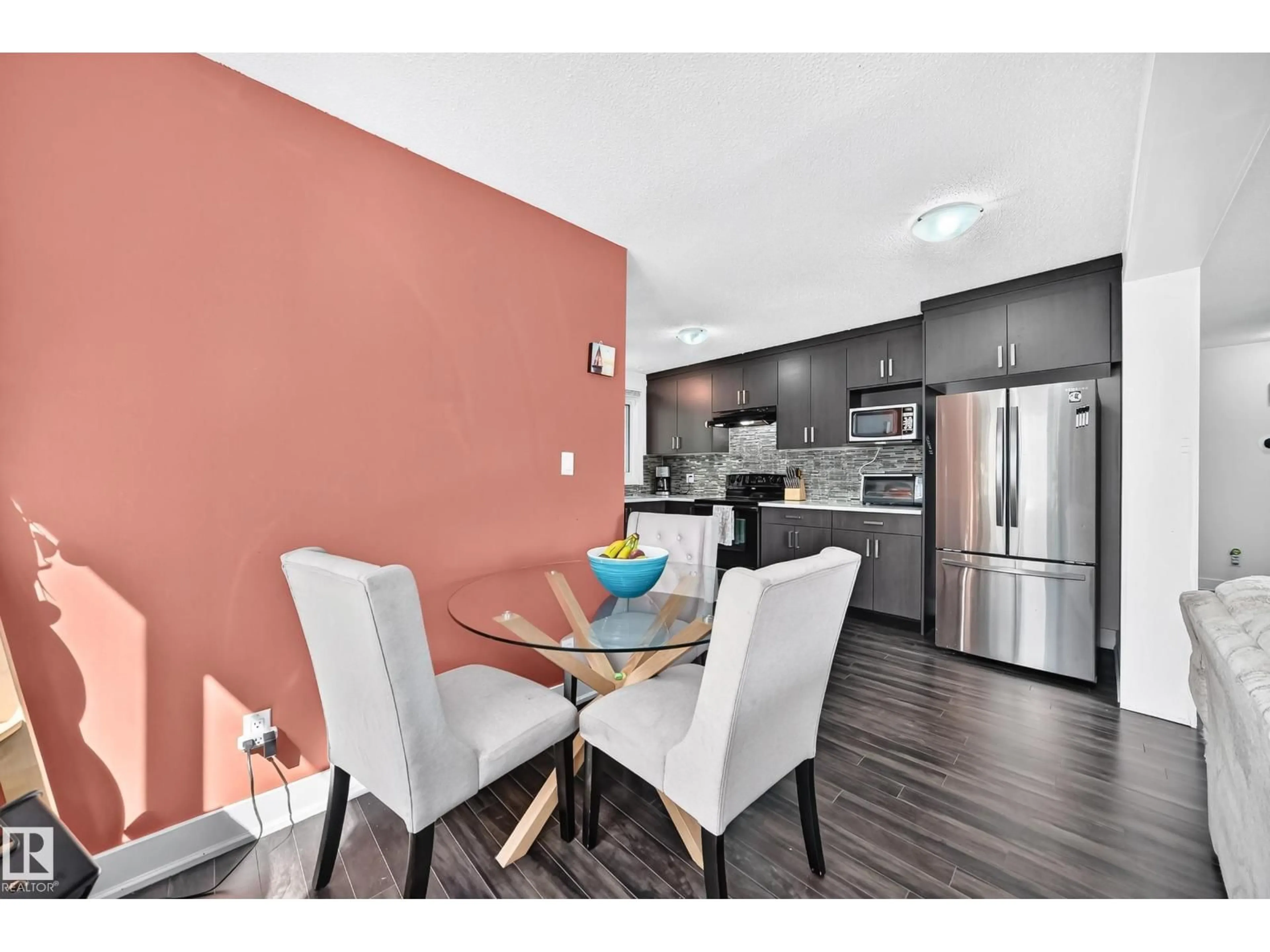 Open concept kitchen, wood/laminate floor for 2112 36 ST, Edmonton Alberta T6L3G4