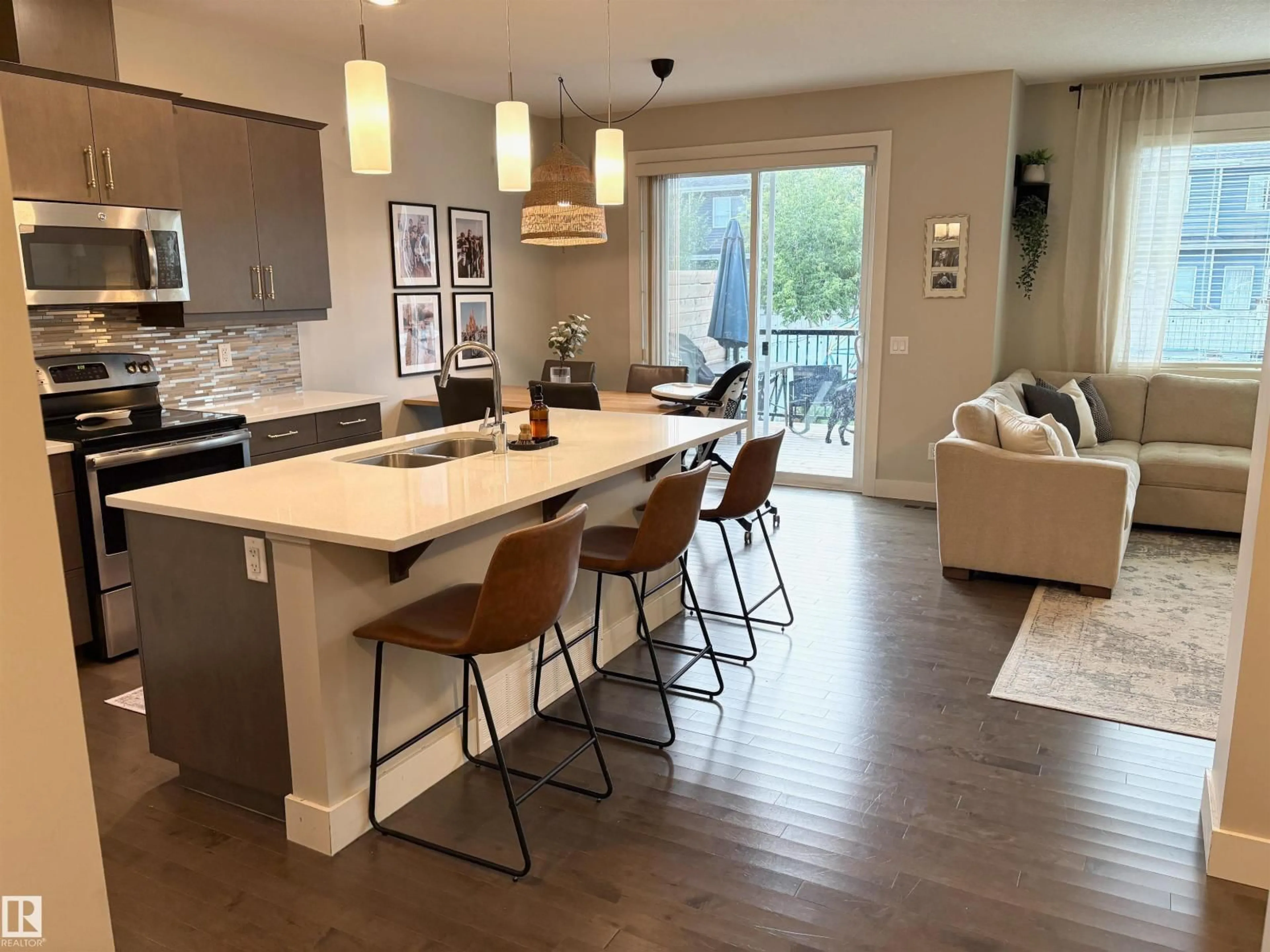 Open concept kitchen, wood/laminate floor for 152 STURTZ BN, Leduc Alberta T9E1E3