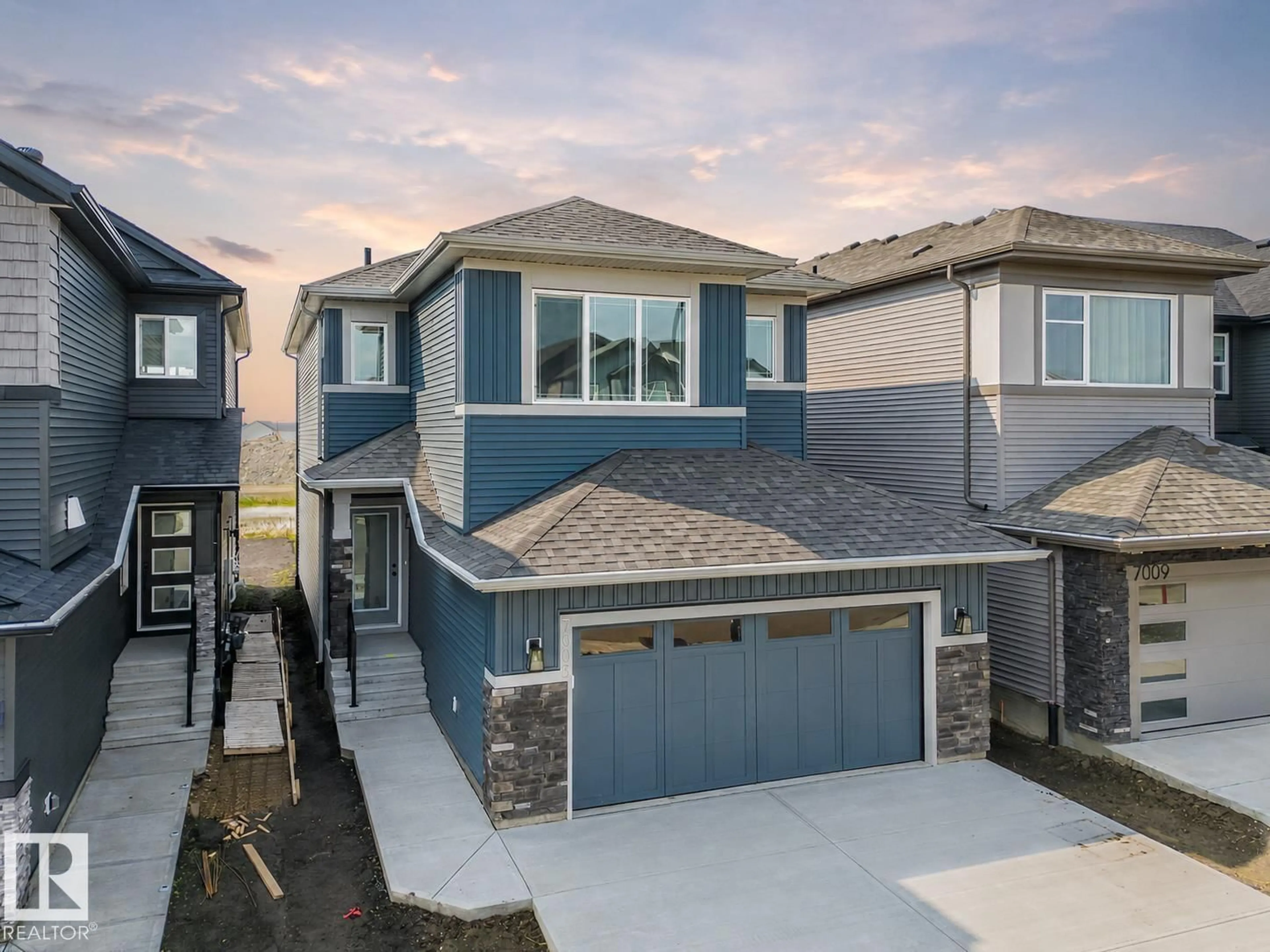 A pic from outside/outdoor area/front of a property/back of a property/a pic from drone, street for 7005 176A AV, Edmonton Alberta T5Z0X8