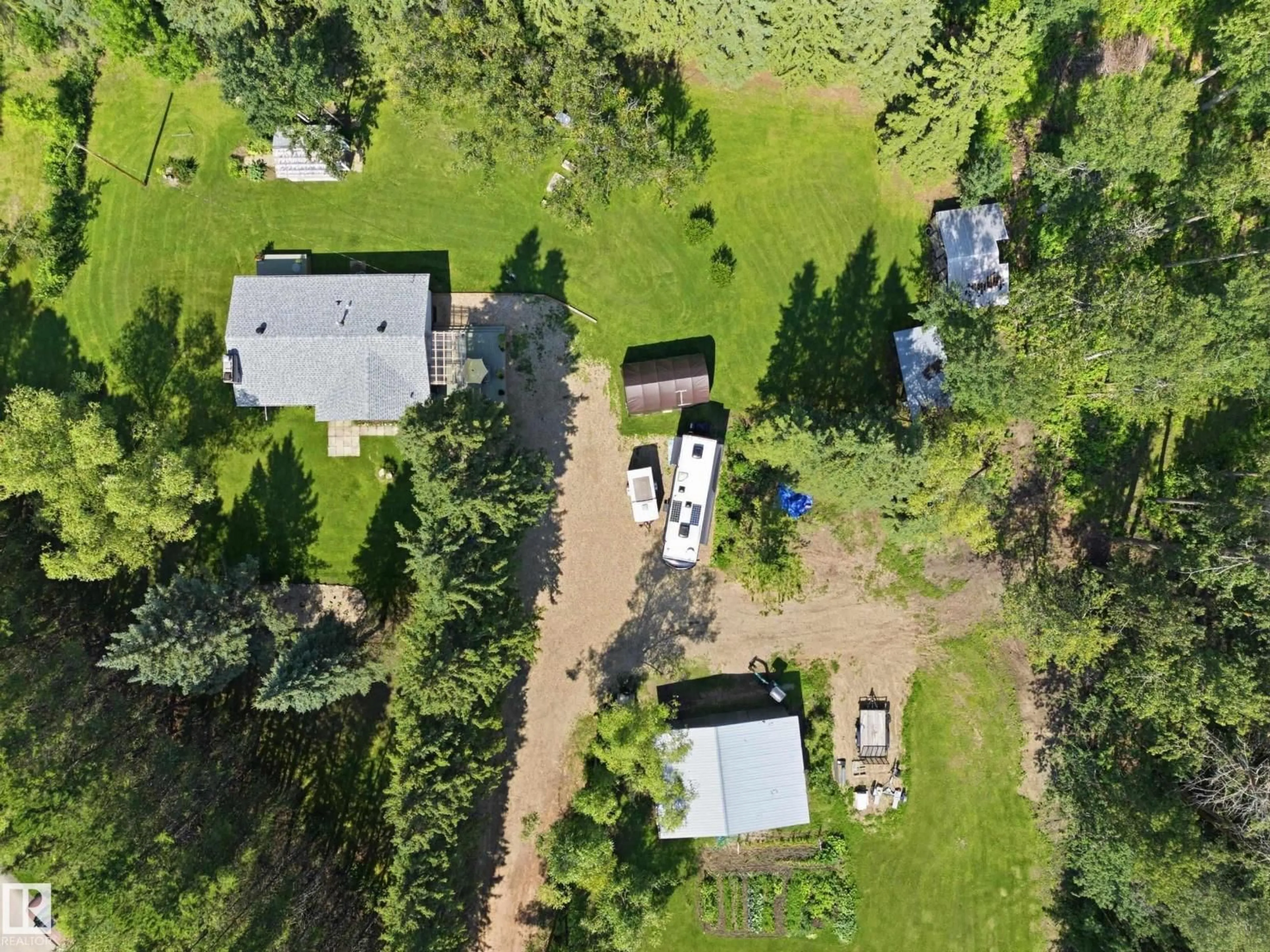 A pic from outside/outdoor area/front of a property/back of a property/a pic from drone, forest/trees view for 60 2304 TWP ROAD 522, Rural Parkland County Alberta T0E0H0