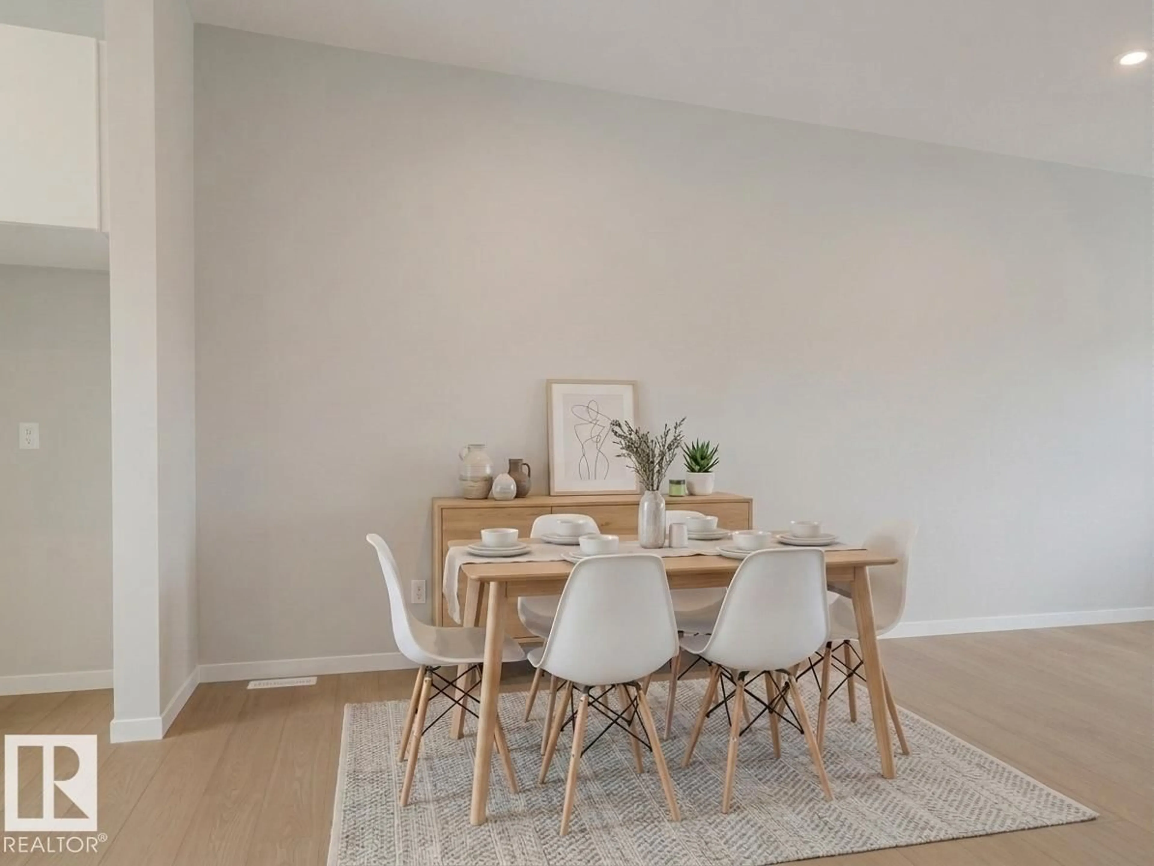 Dining room, wood/laminate floor for 19604 30 AV NW, Edmonton Alberta T6M3L9