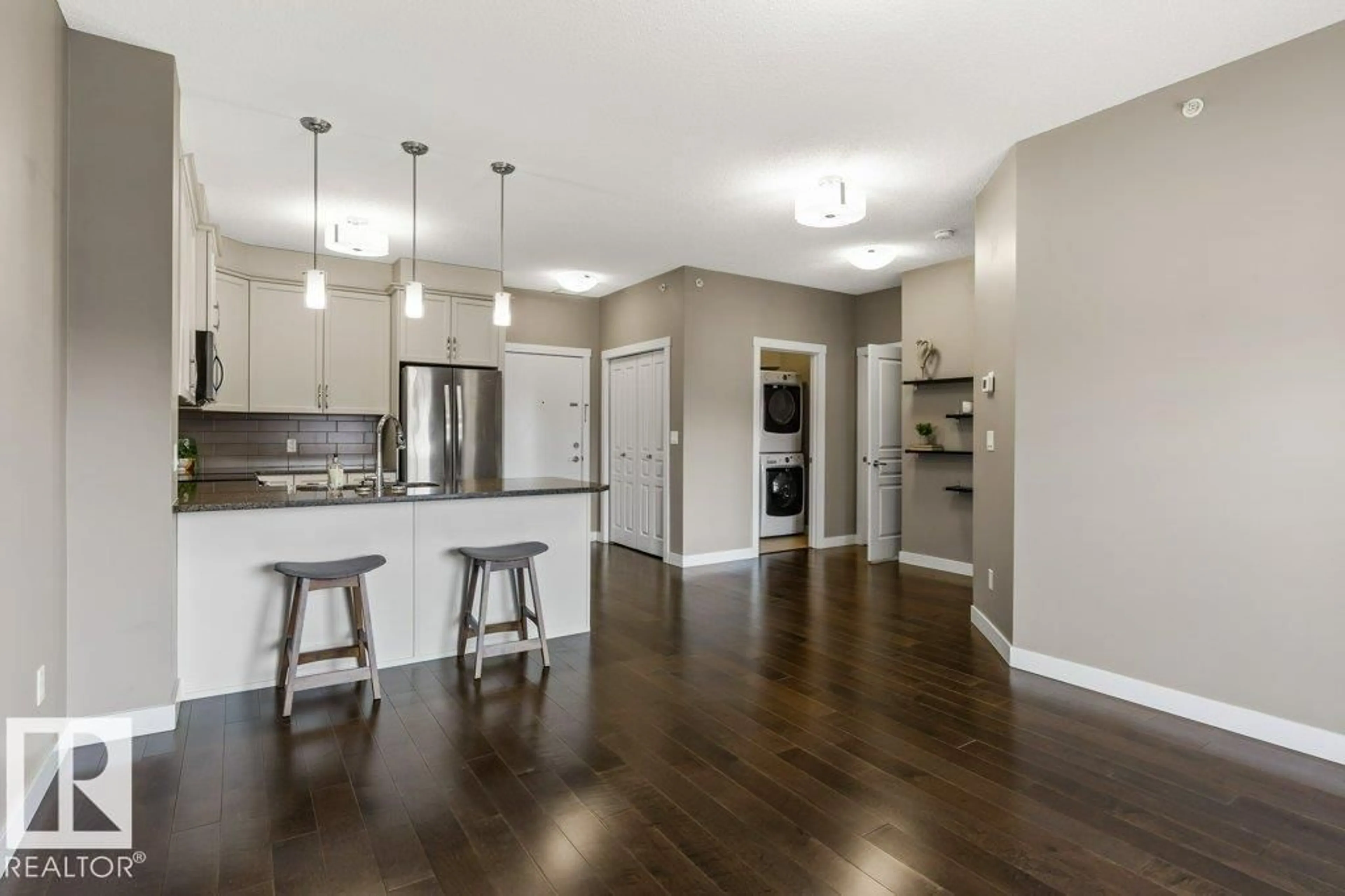 Open concept kitchen, wood/laminate floor for 409 - 2207 44 AV NW, Edmonton Alberta T6T0T2
