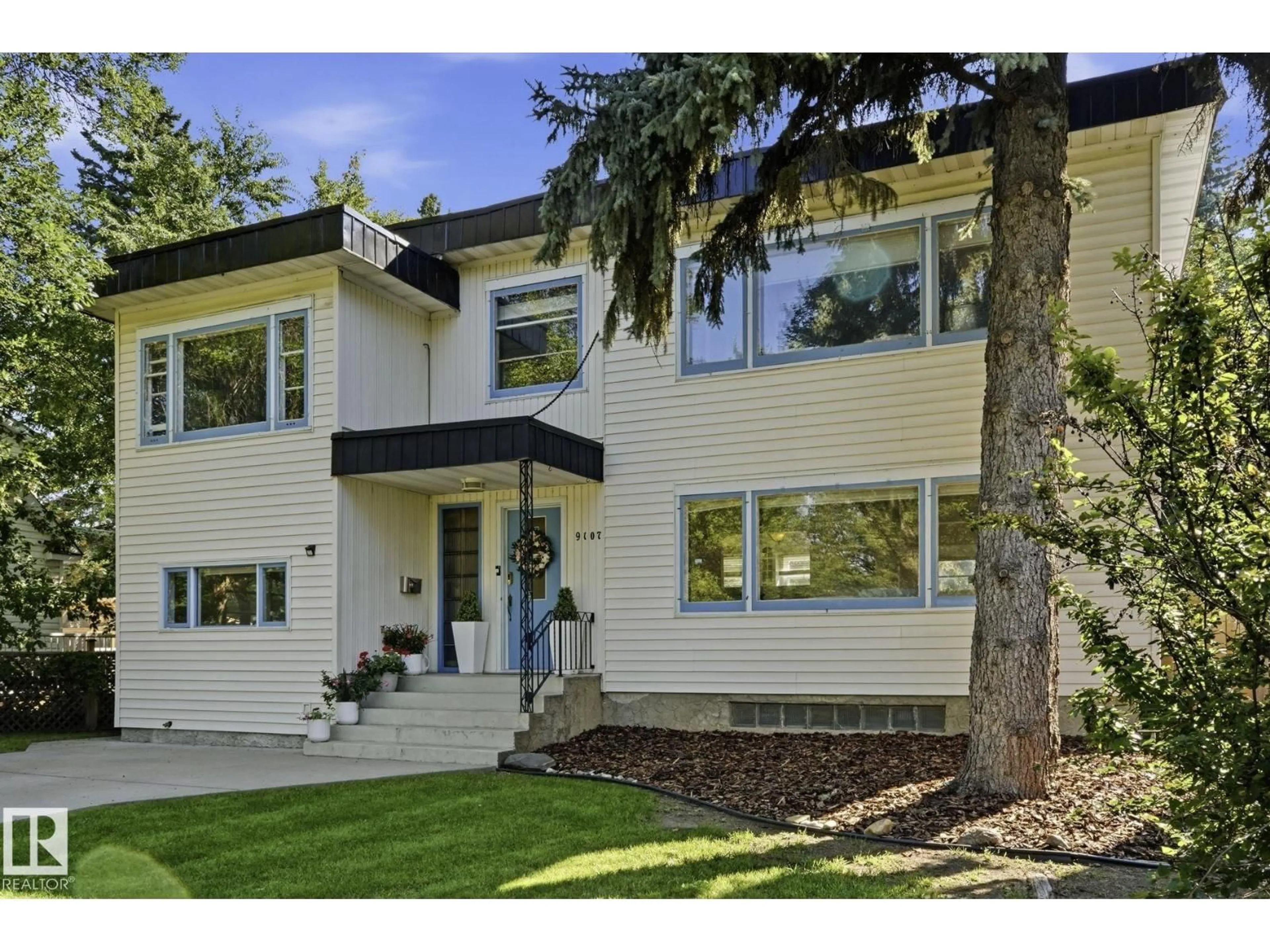 Home with vinyl exterior material, street for NW - 9107 118 ST, Edmonton Alberta T6G1T6