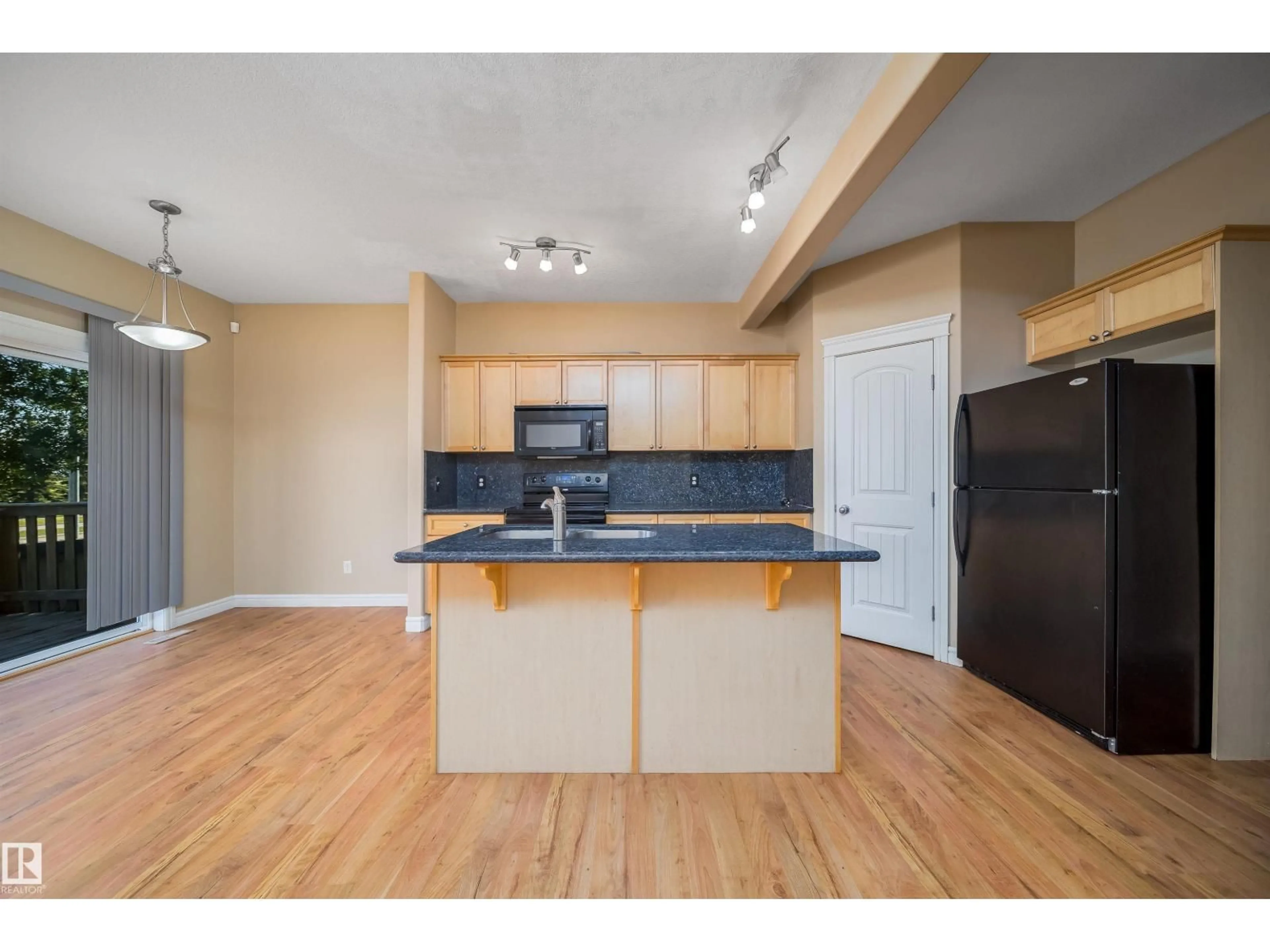 Open concept kitchen, wood/laminate floor for 46 15151 43 ST NW, Edmonton Alberta T5Y0L3