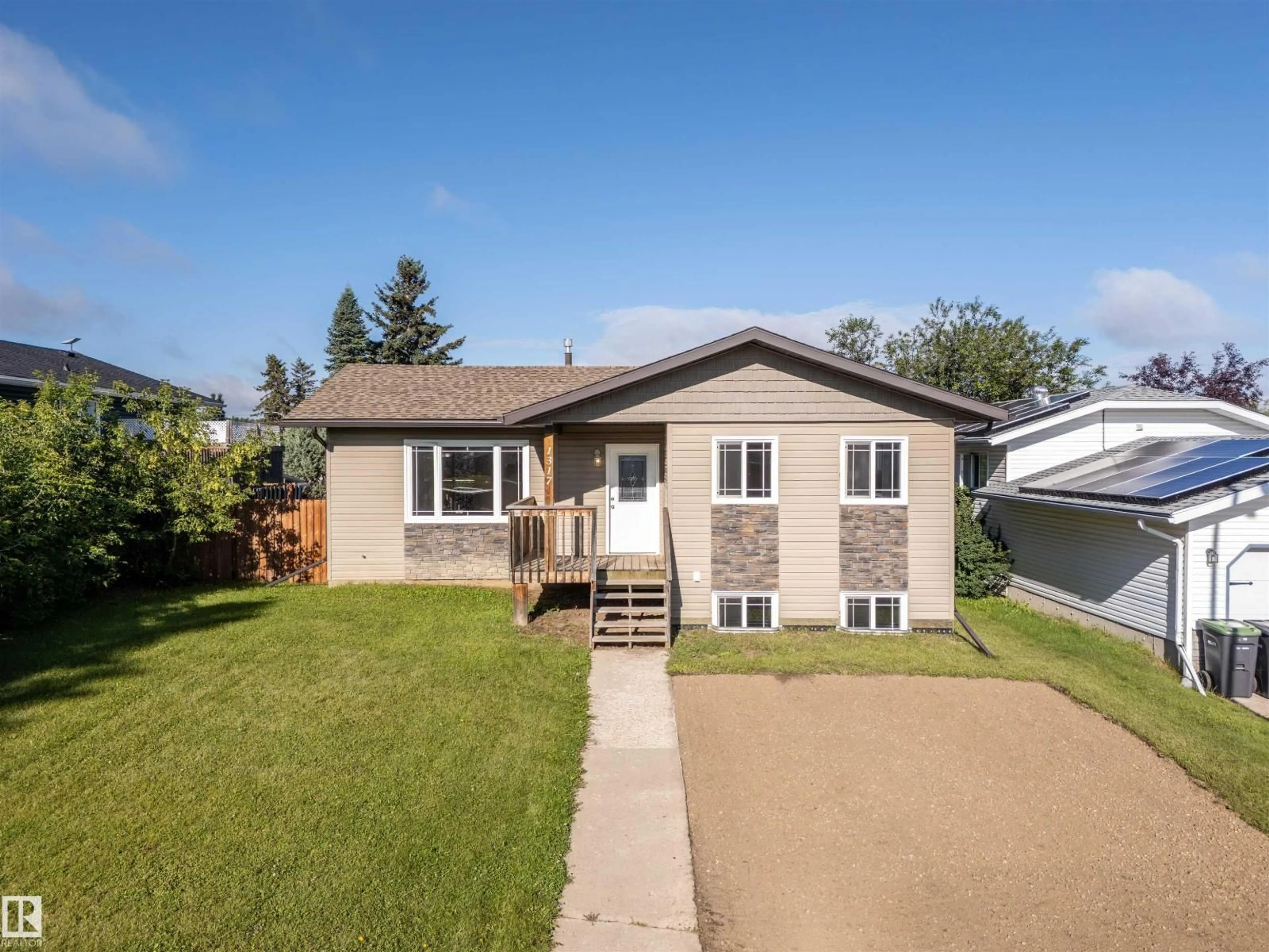 Home with vinyl exterior material, street for 1317 11 ST, Cold Lake Alberta T9M1J5