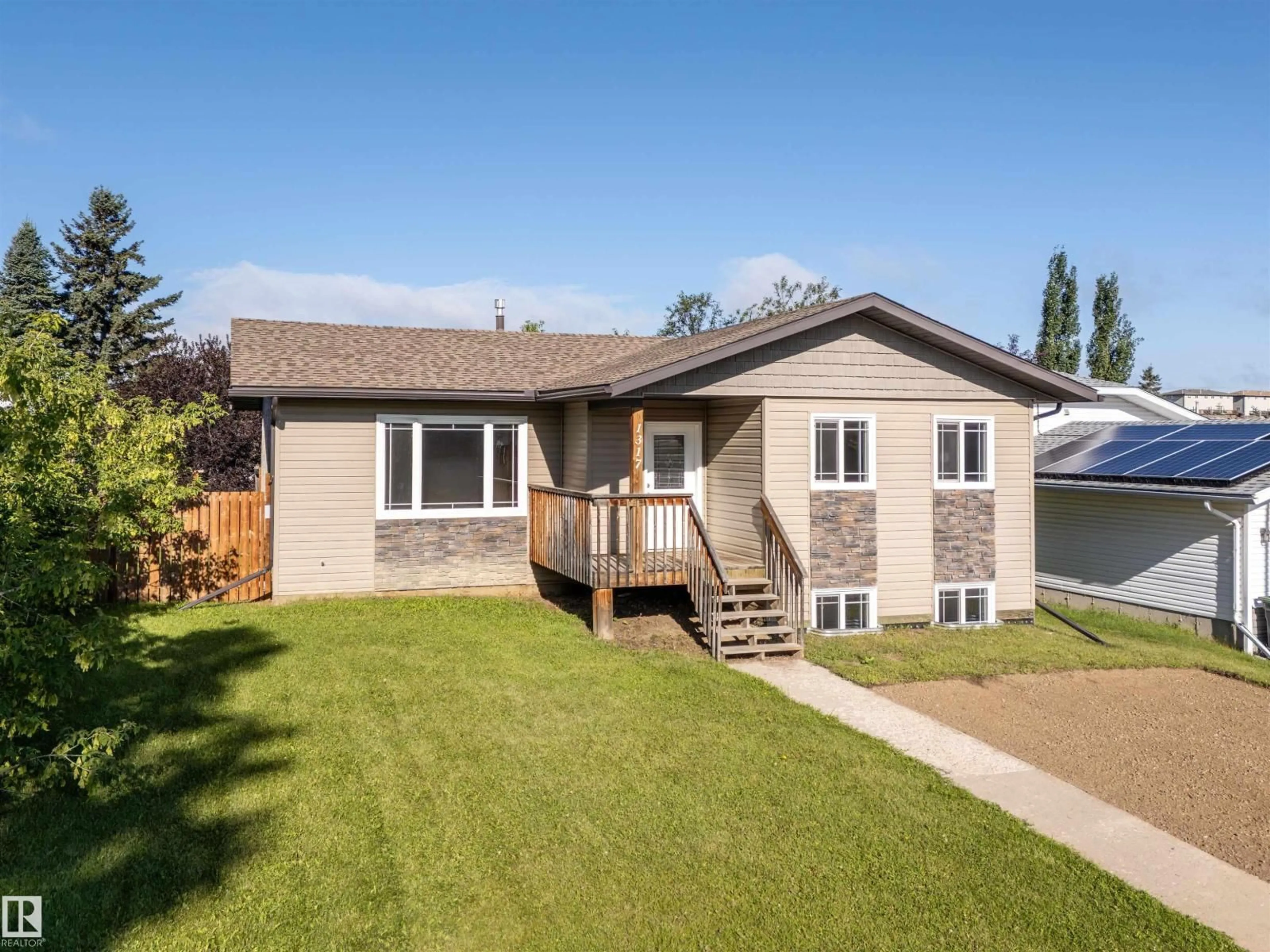 Home with vinyl exterior material, street for 1317 11 ST, Cold Lake Alberta T9M1J5