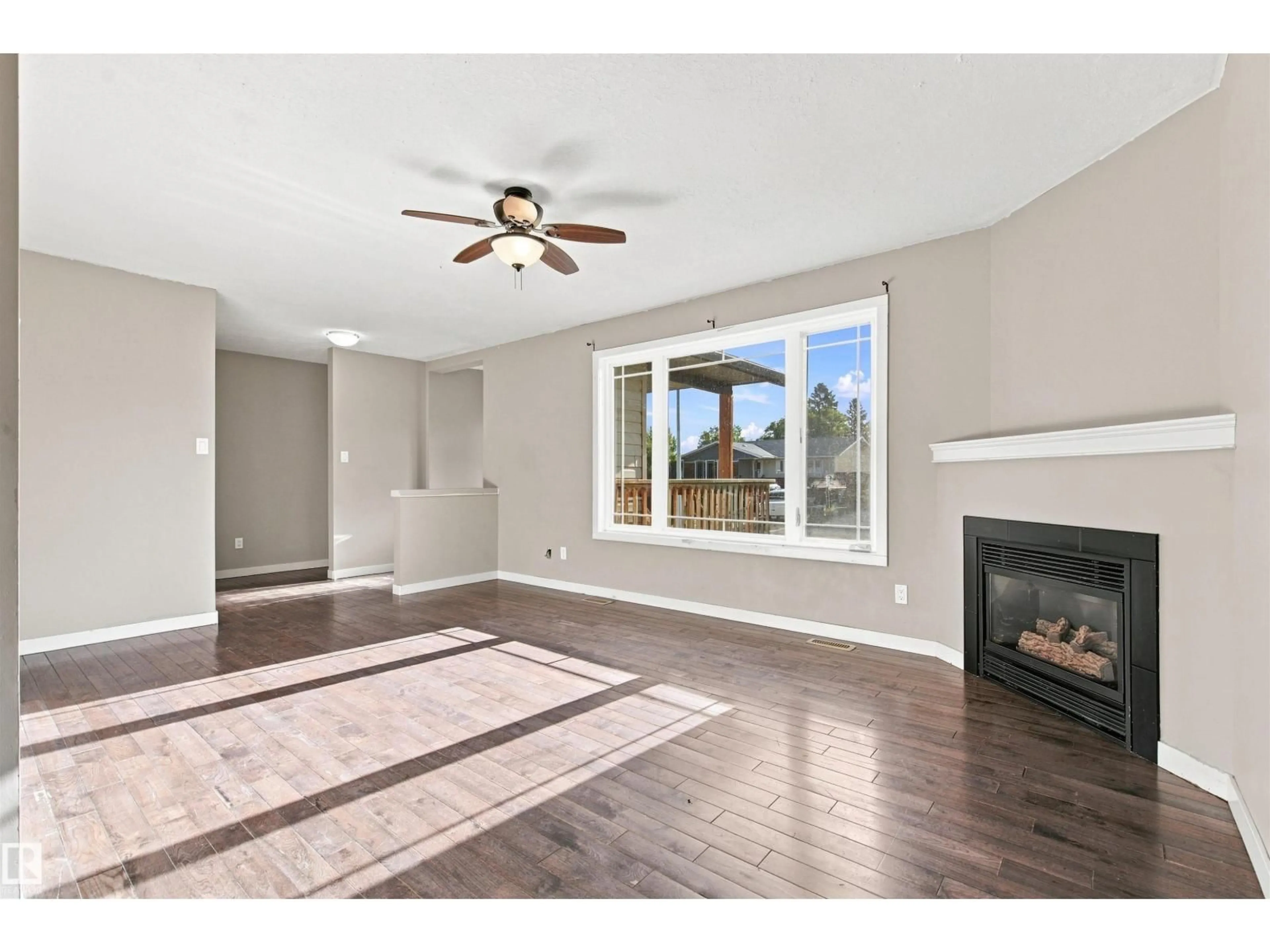 Living room with furniture, wood/laminate floor for 1317 11 ST, Cold Lake Alberta T9M1J5
