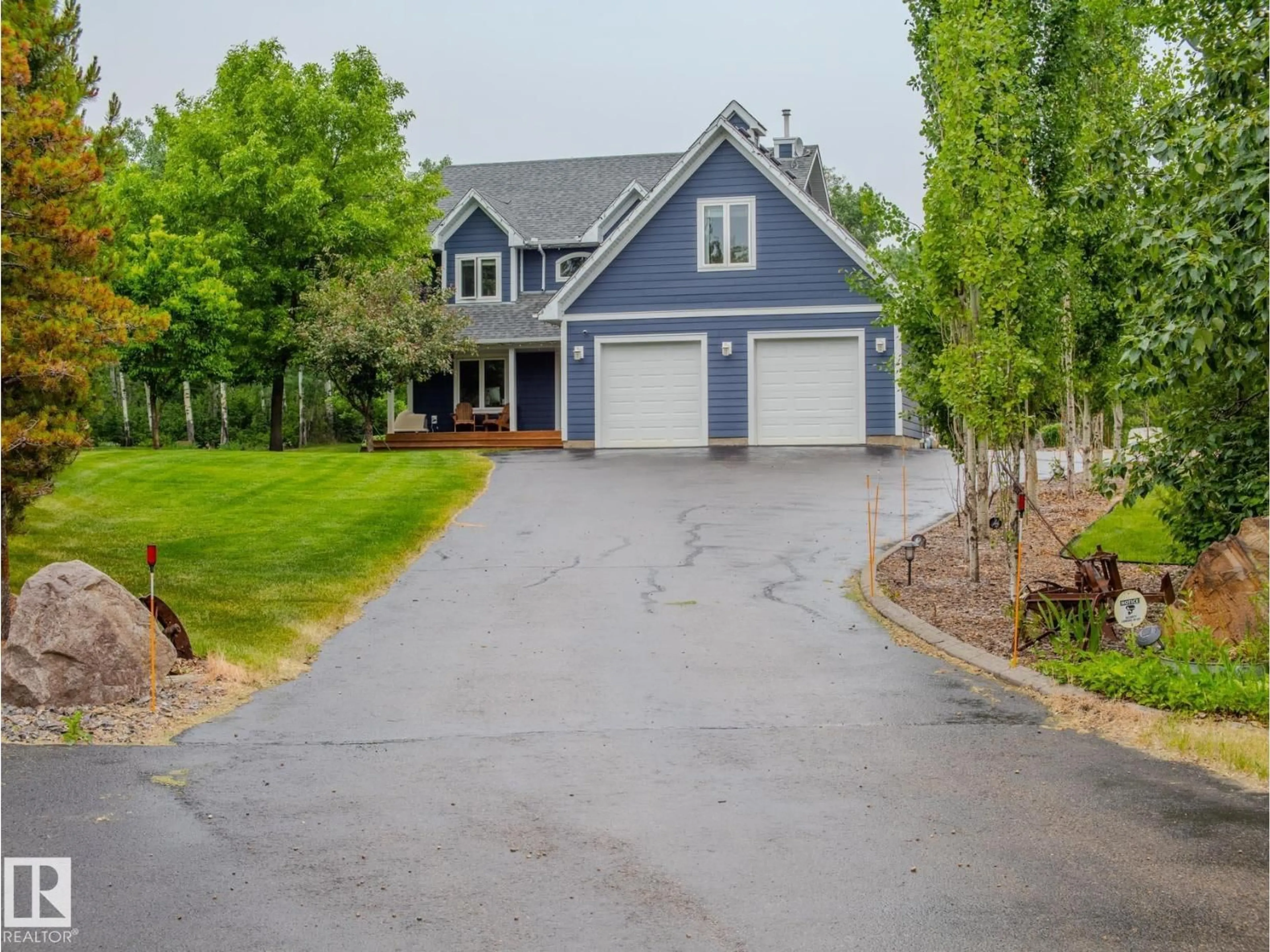 Home with vinyl exterior material, street for 4 TWP ROAD 540, Rural Parkland County Alberta T7X3V4
