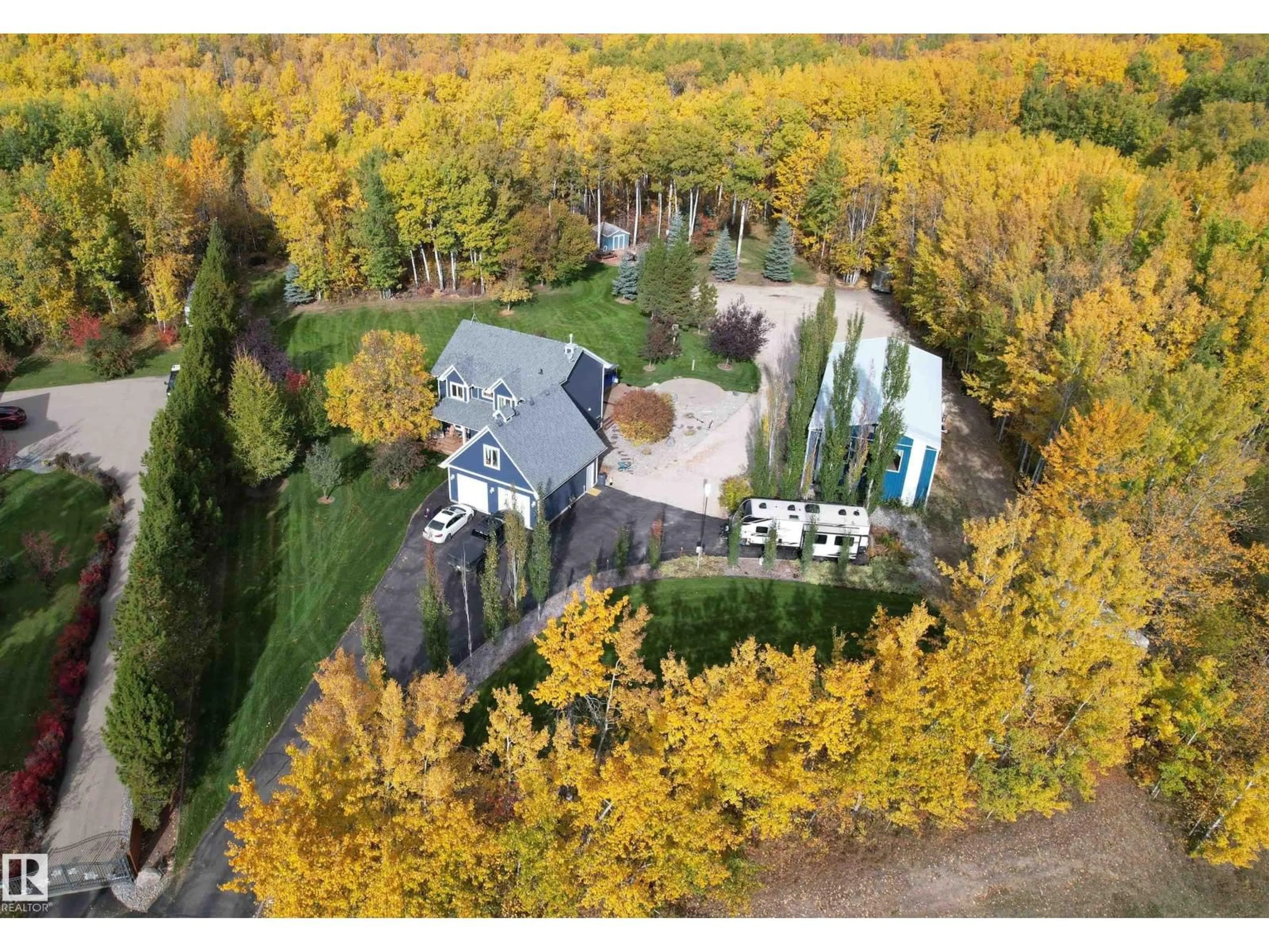 A pic from outside/outdoor area/front of a property/back of a property/a pic from drone, forest/trees view for 4 TWP ROAD 540, Rural Parkland County Alberta T7X3V4