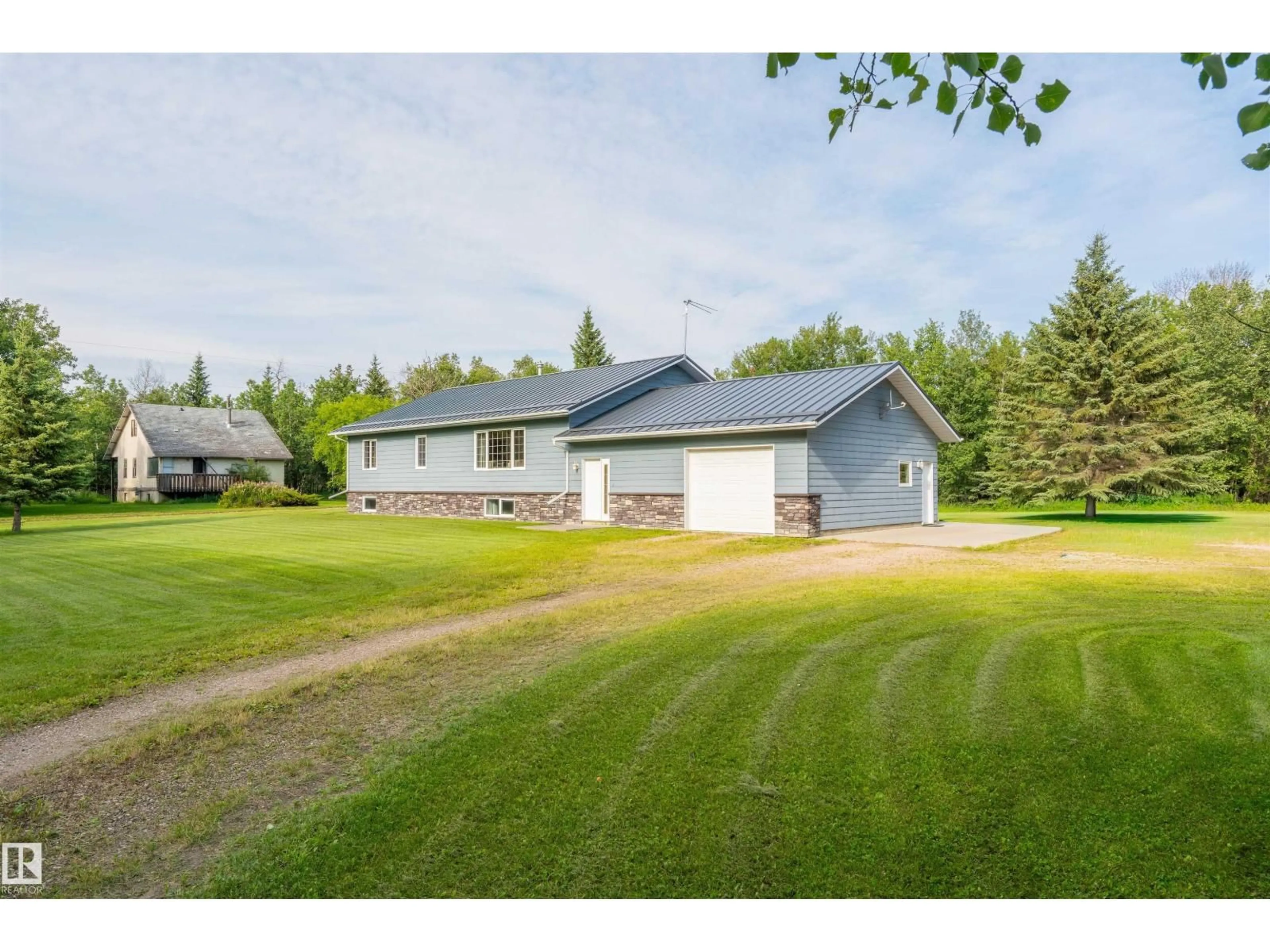 A pic from outside/outdoor area/front of a property/back of a property/a pic from drone, unknown for 59125 RANGE ROAD 102, Rural St. Paul County Alberta T0A3A0
