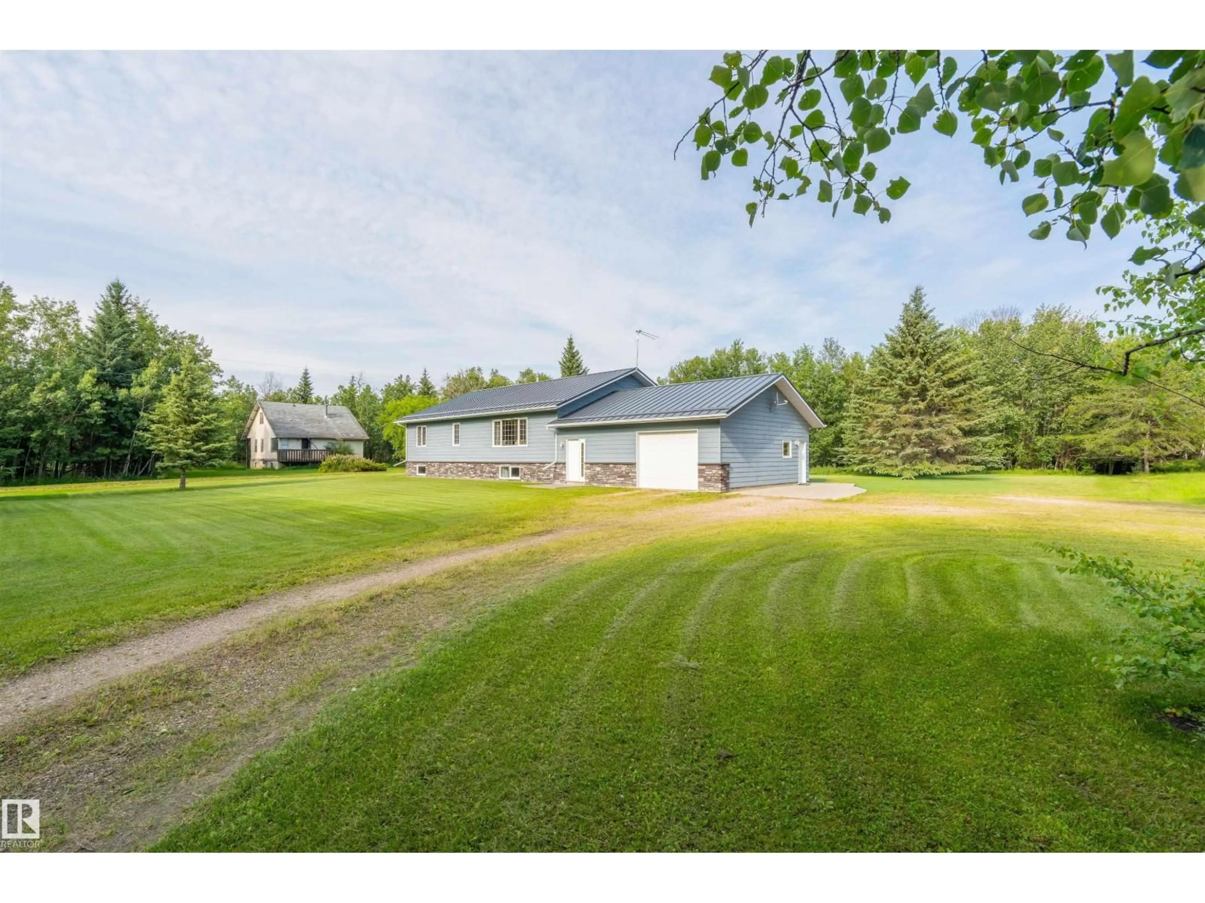 A pic from outside/outdoor area/front of a property/back of a property/a pic from drone, unknown for 59125 RANGE ROAD 102, Rural St. Paul County Alberta T0A3A0